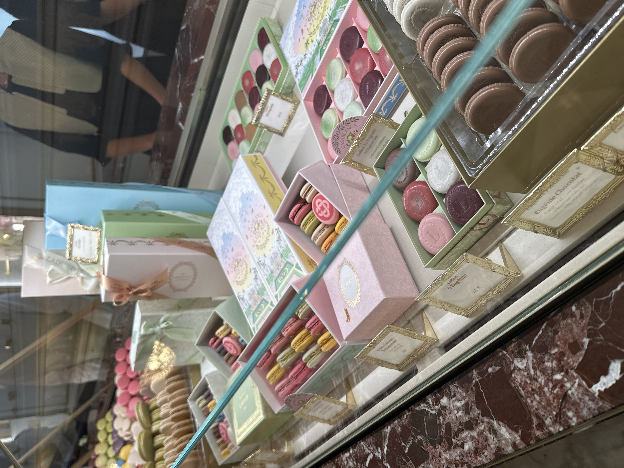 Colorful macarons and decorative boxes on display in Paris