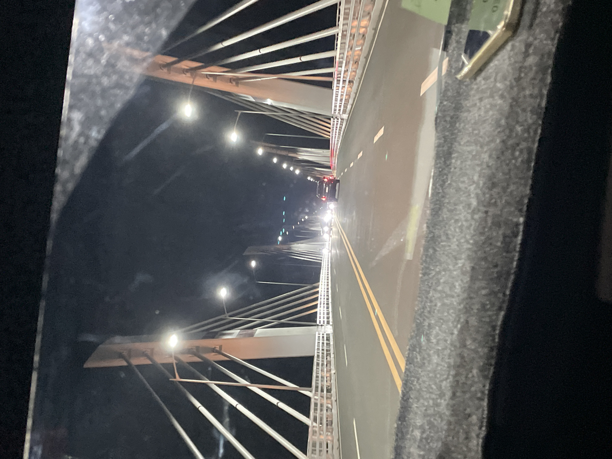 Night traffic recorded on illuminated bridge in Davao City