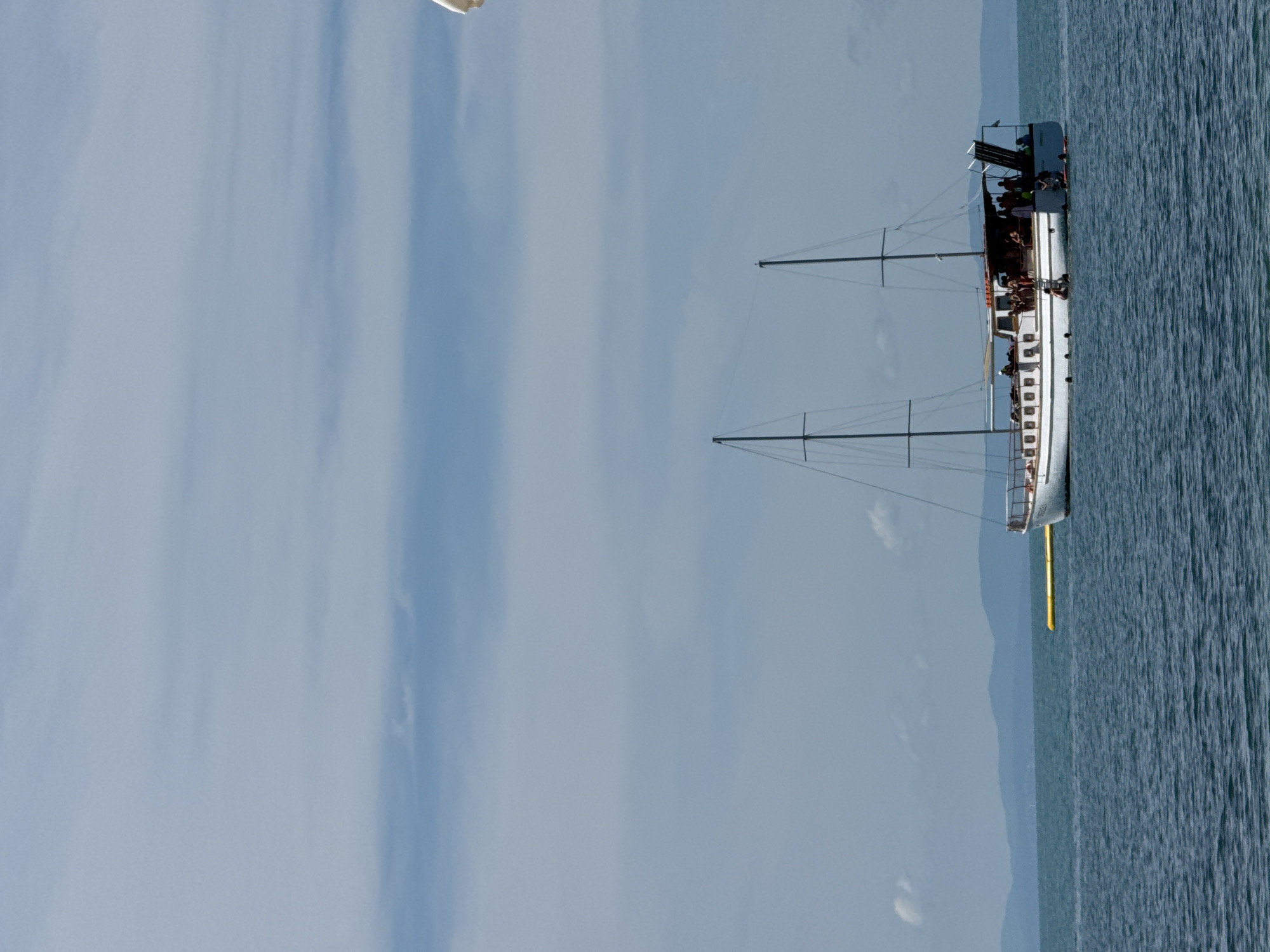 Group out on a sailboat, calm seas, leisure mode