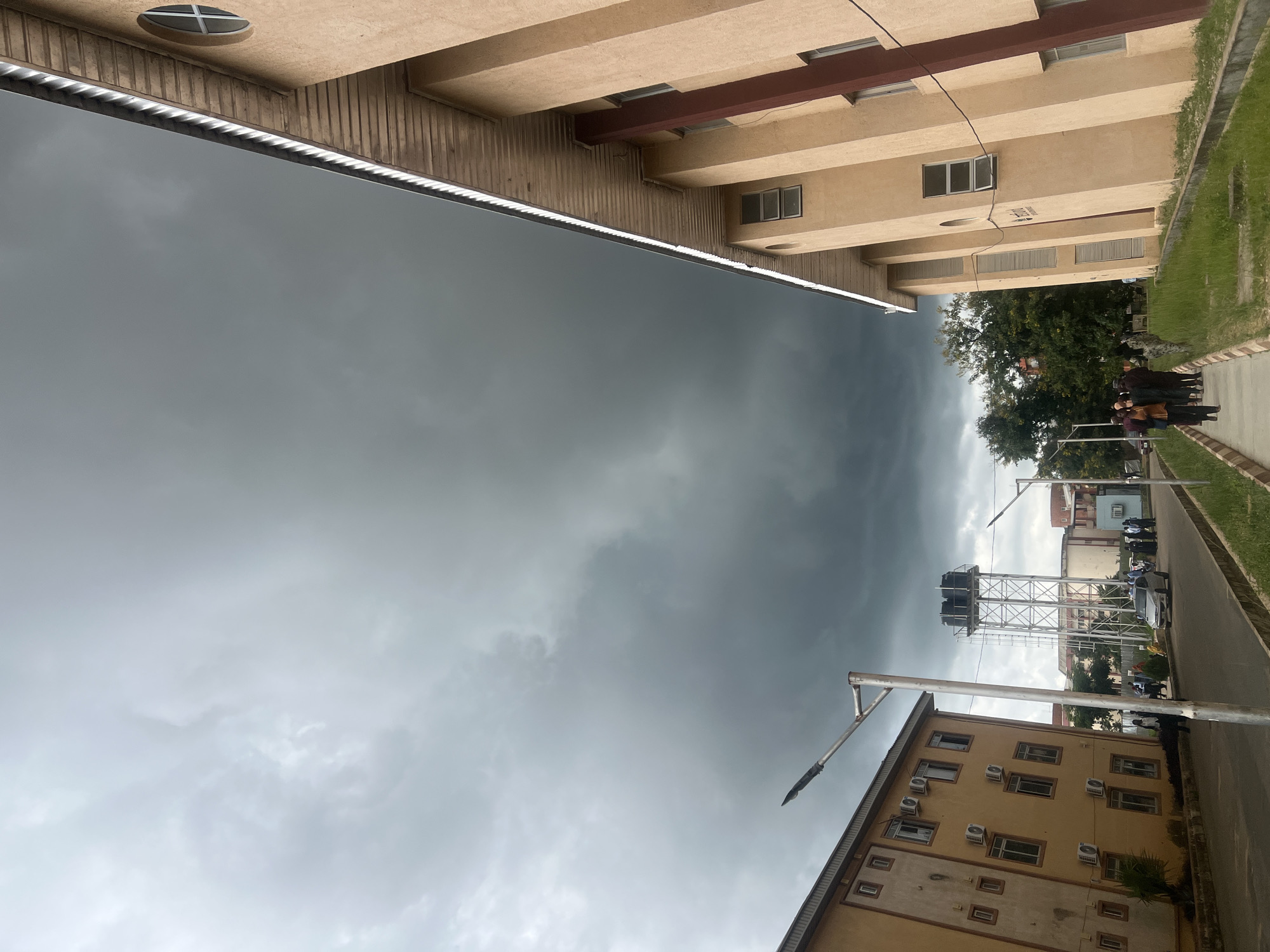 Storm rolls into Rafin Par as people move through wet streets