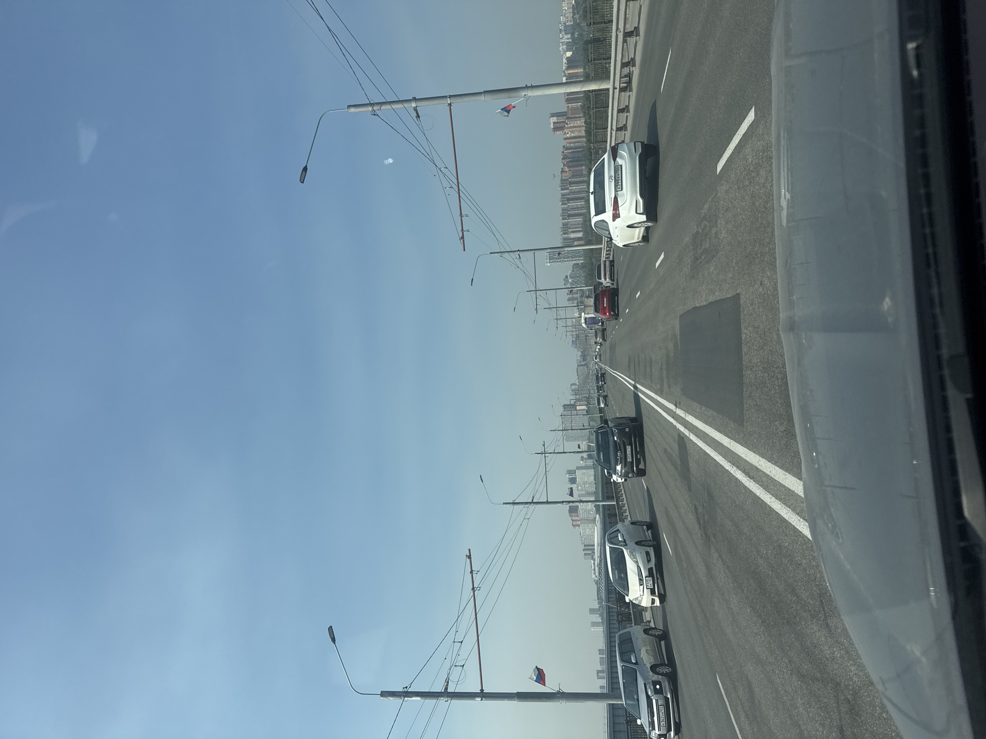 Driving across a Novosibirsk bridge on a clear day