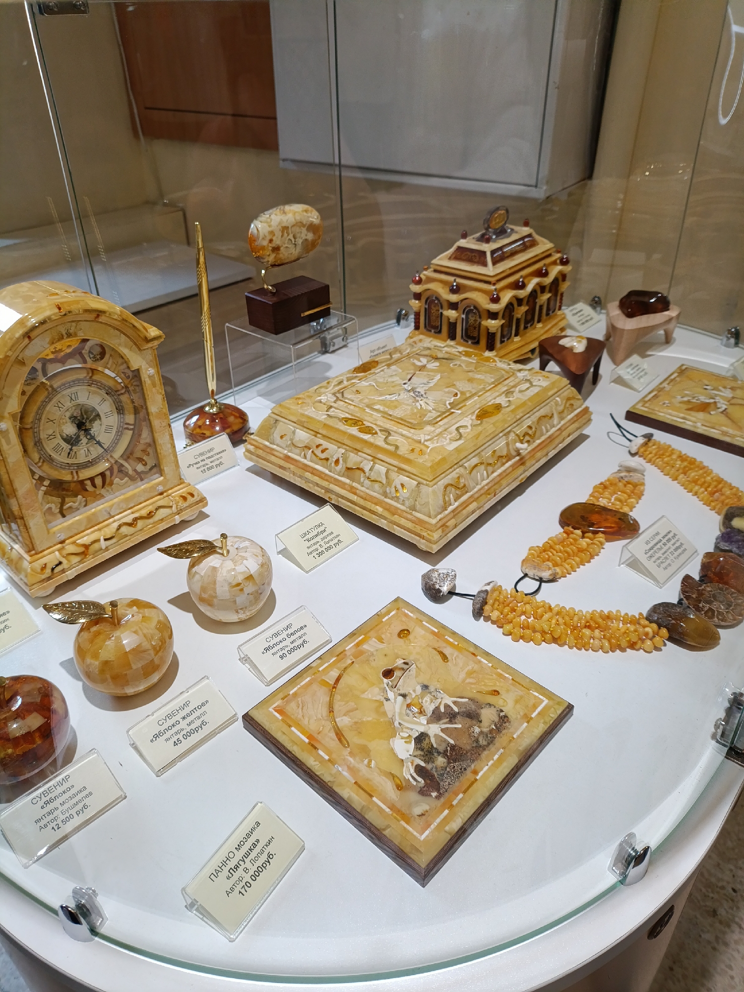 Tourist captures amber shop display and traditional figurine in Kaliningrad
