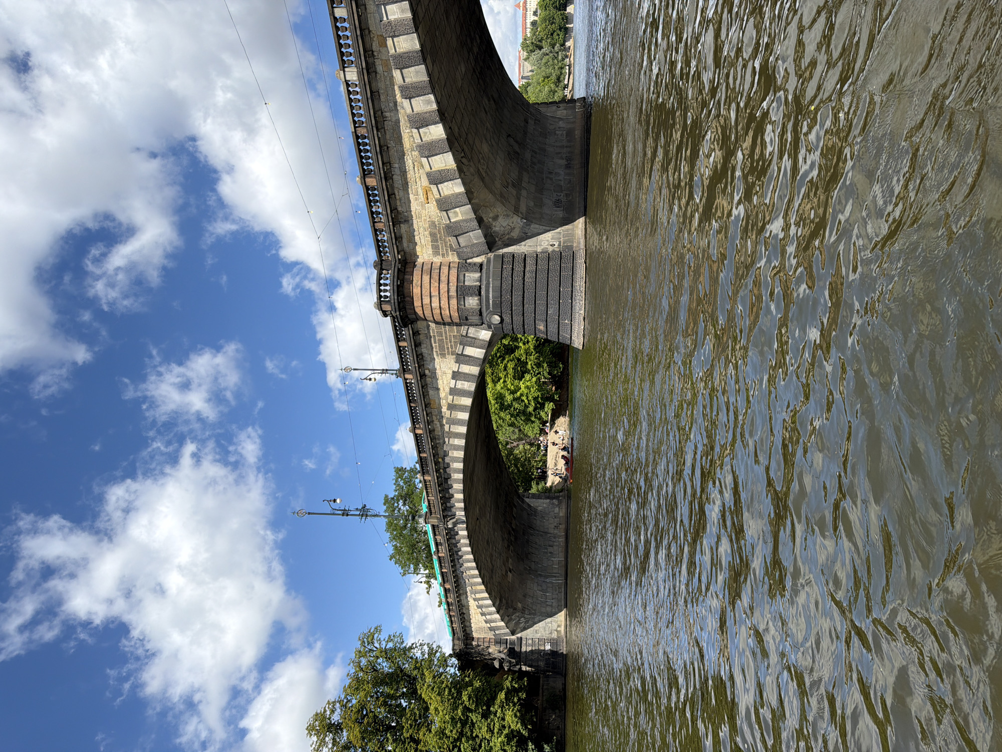 Morning boat ride along the Vltava with views of Prague's stone bridges