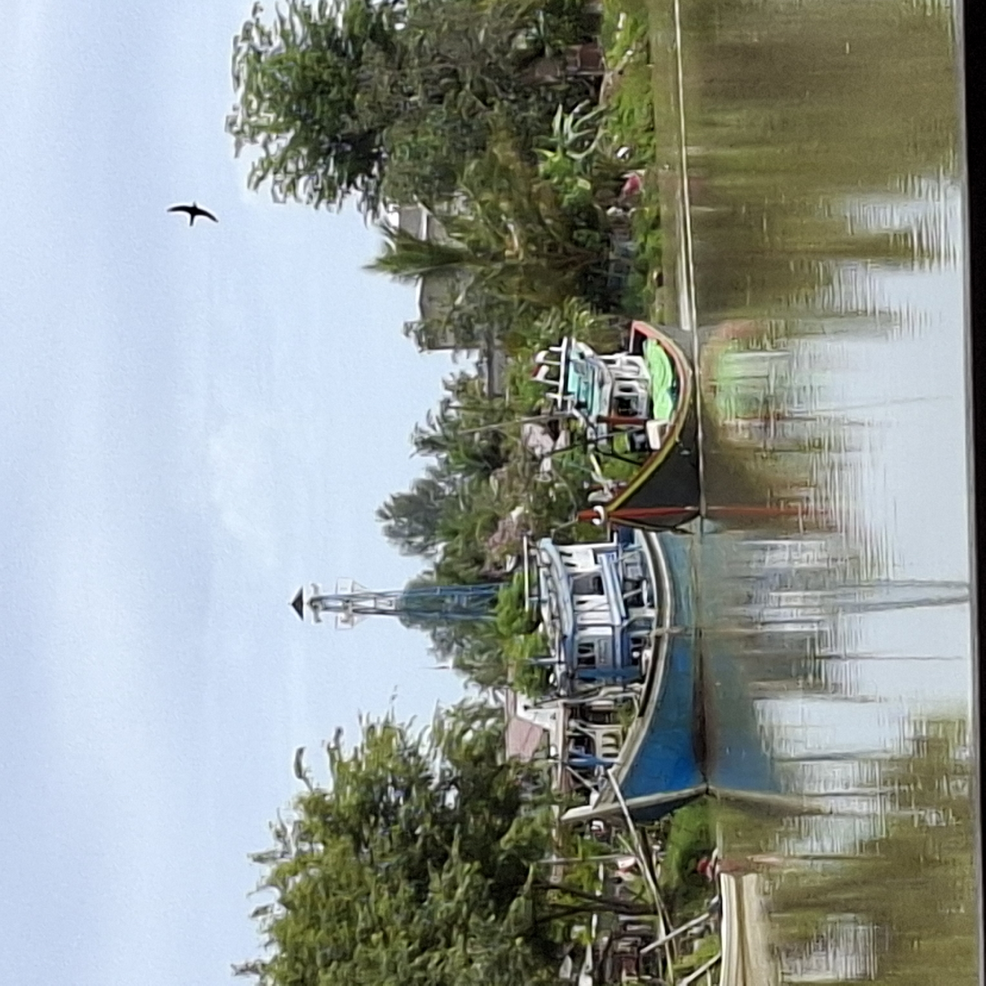 Boats, market stalls, and coffee on a quiet Indonesian morning