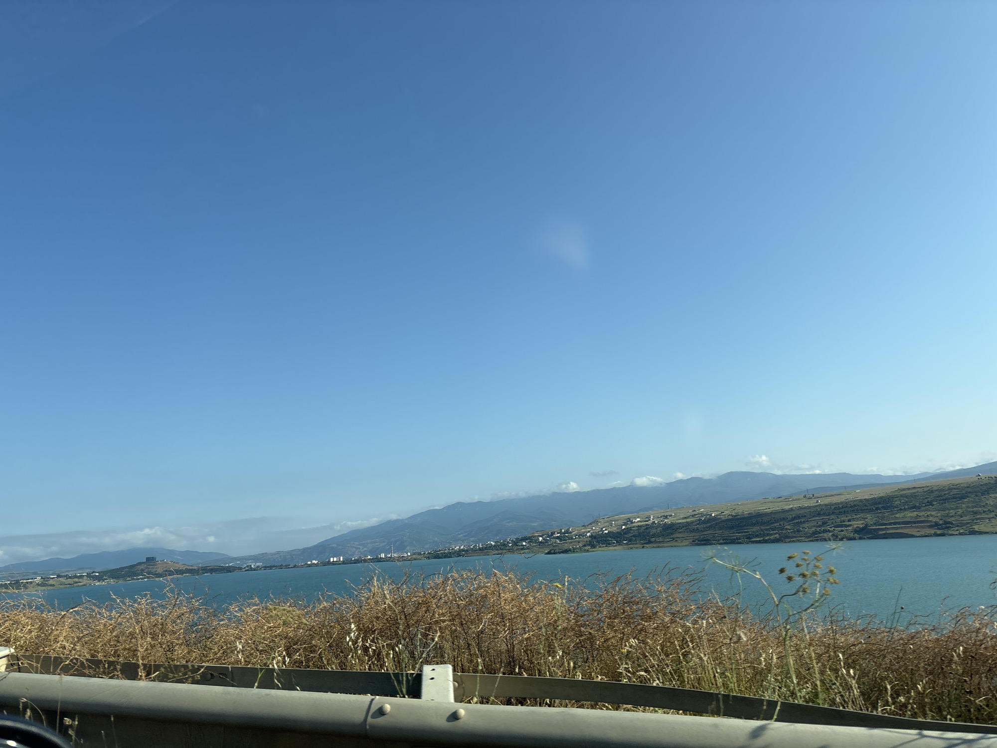 Driving the roads around Tbilisi Sea on a clear summer day