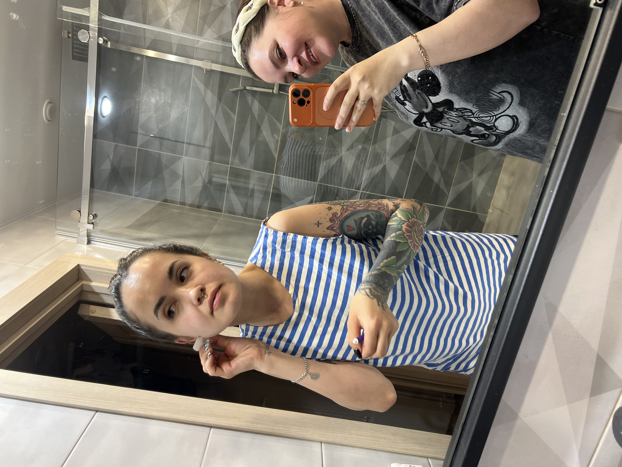 Woman performs ear piercing in Russian bathroom, documents procedure