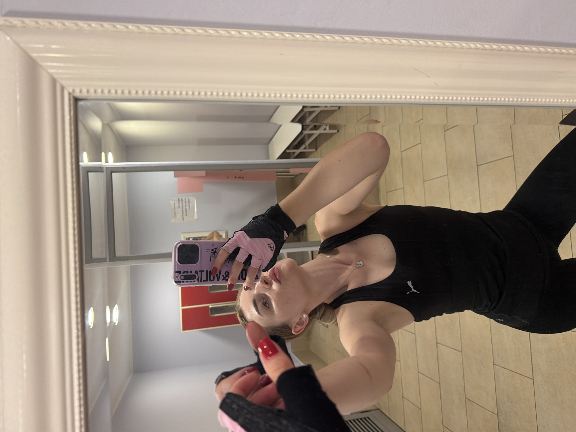 Post-workout locker room selfies with gloves and water bottle