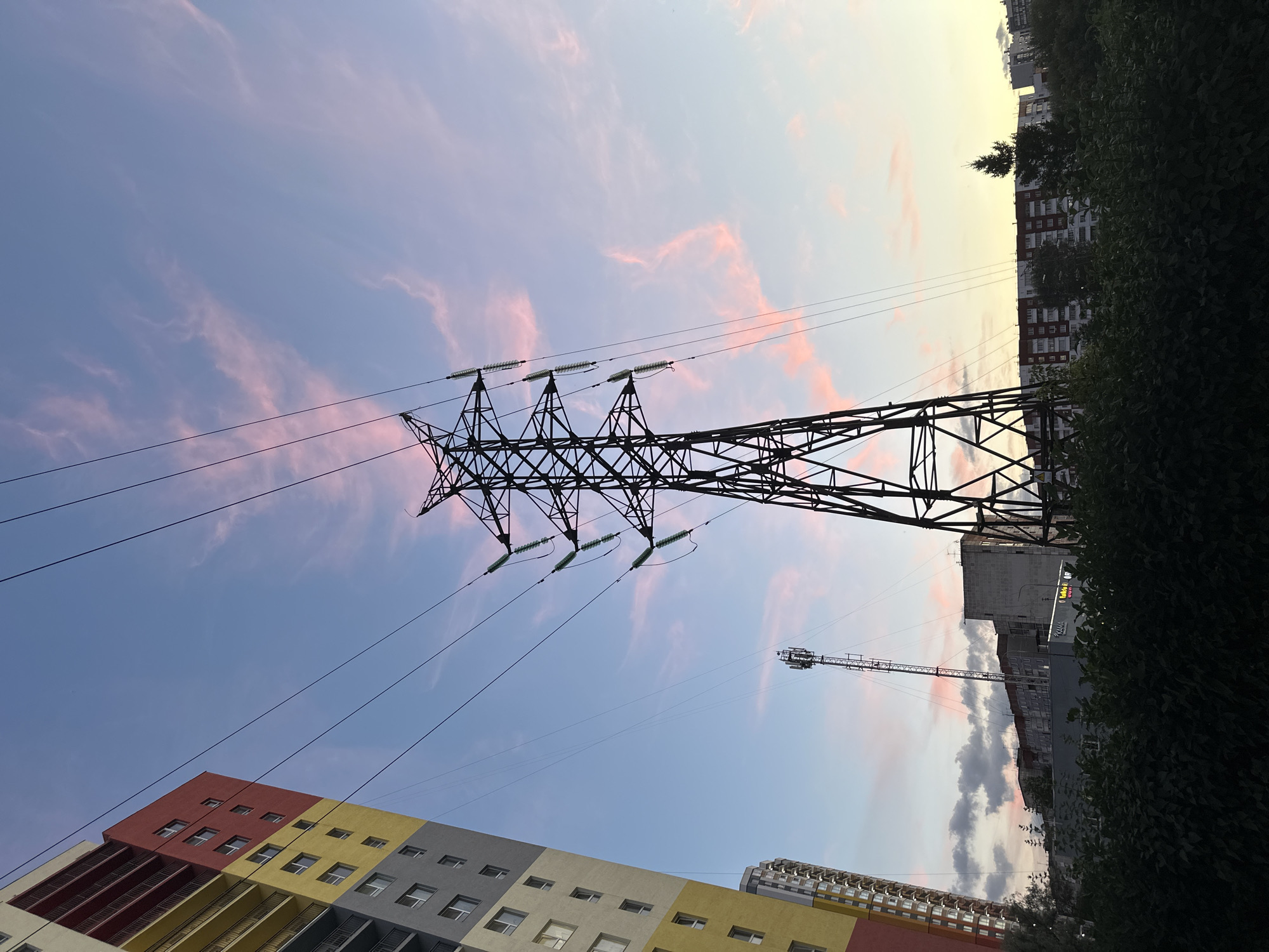 Perm streets glow under a dramatic summer sunset sky