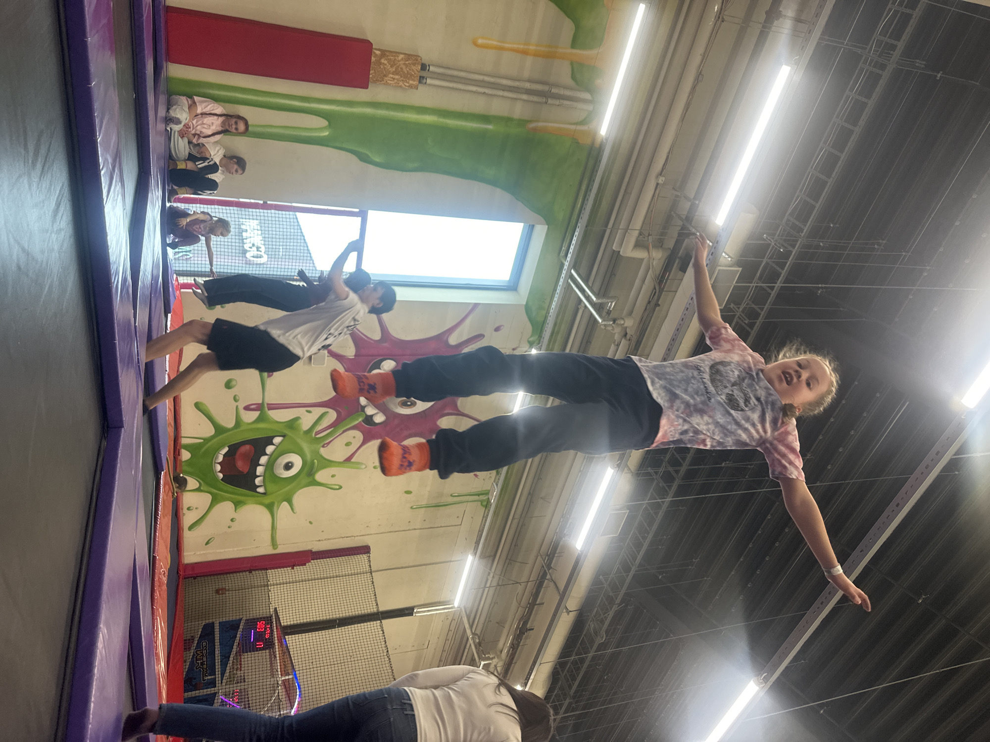 Child plays on indoor swing in Rīga