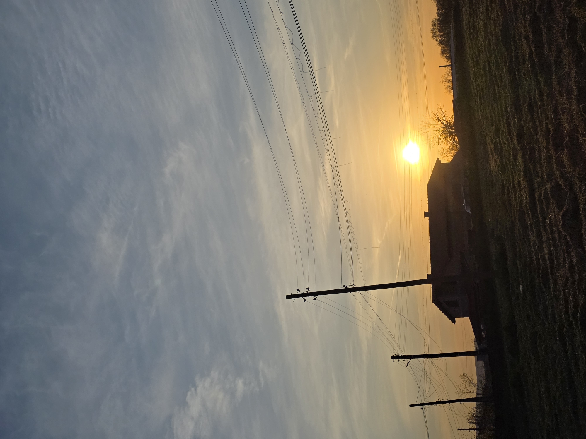Golden hour sunset illuminates peaceful Bulgarian countryside near Drazhevo