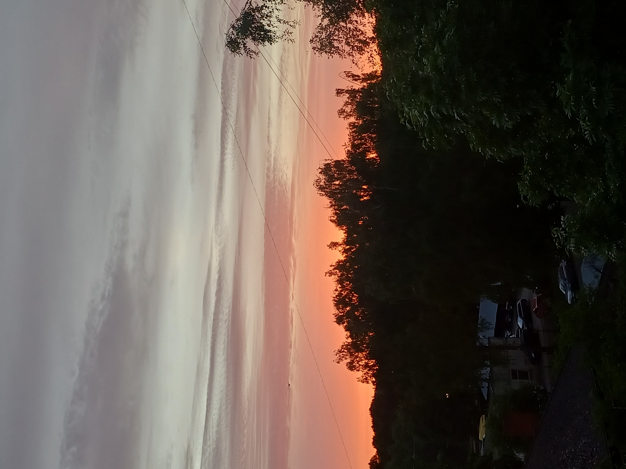 Vibrant sunset observed over Riga during evening twilight hours