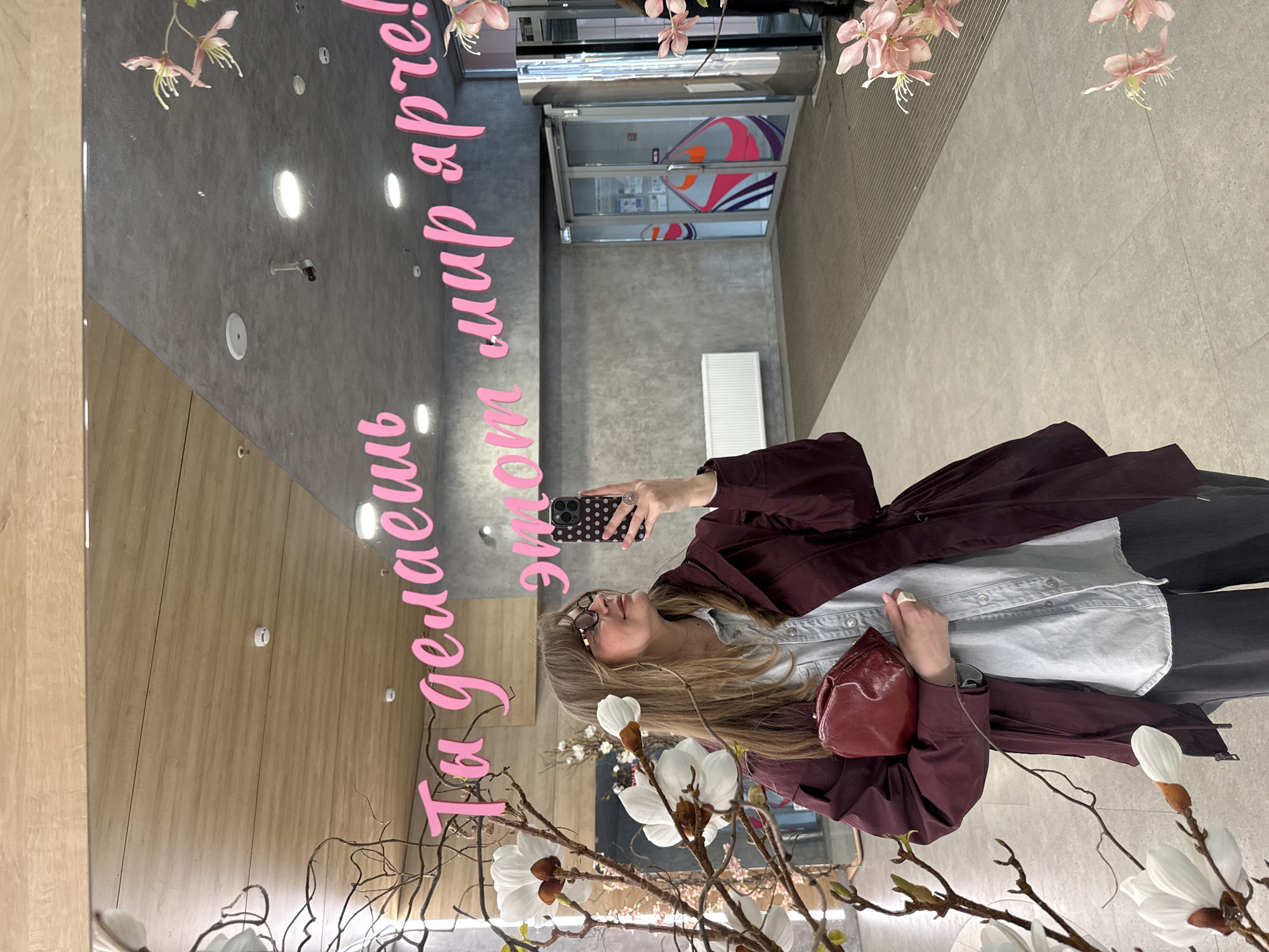 Woman shops for clothing and accessories in Izhevsk store
