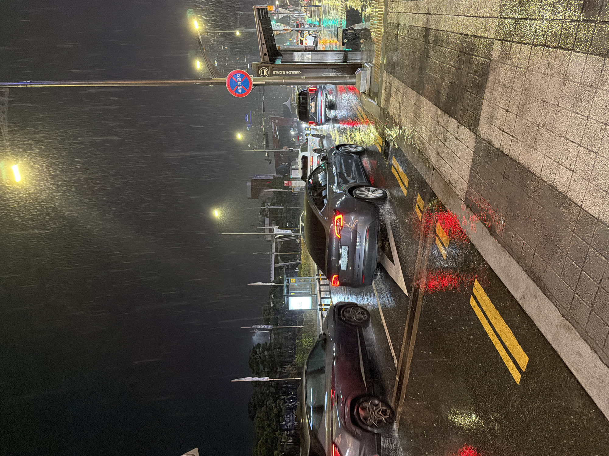 Heavy rain falls on Busan street at night