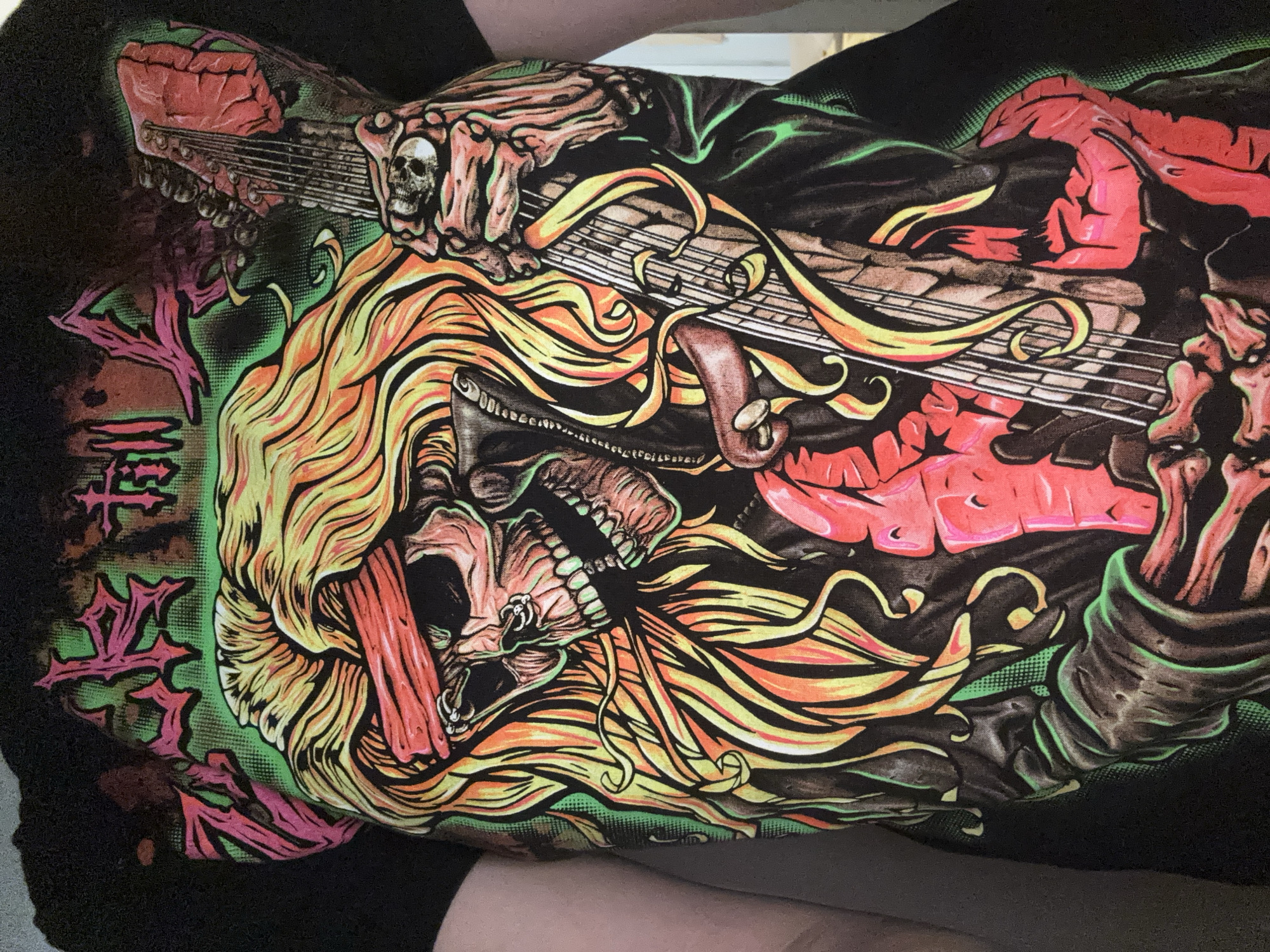 Graphic tee and fabric-draped tree on a Voronezh night