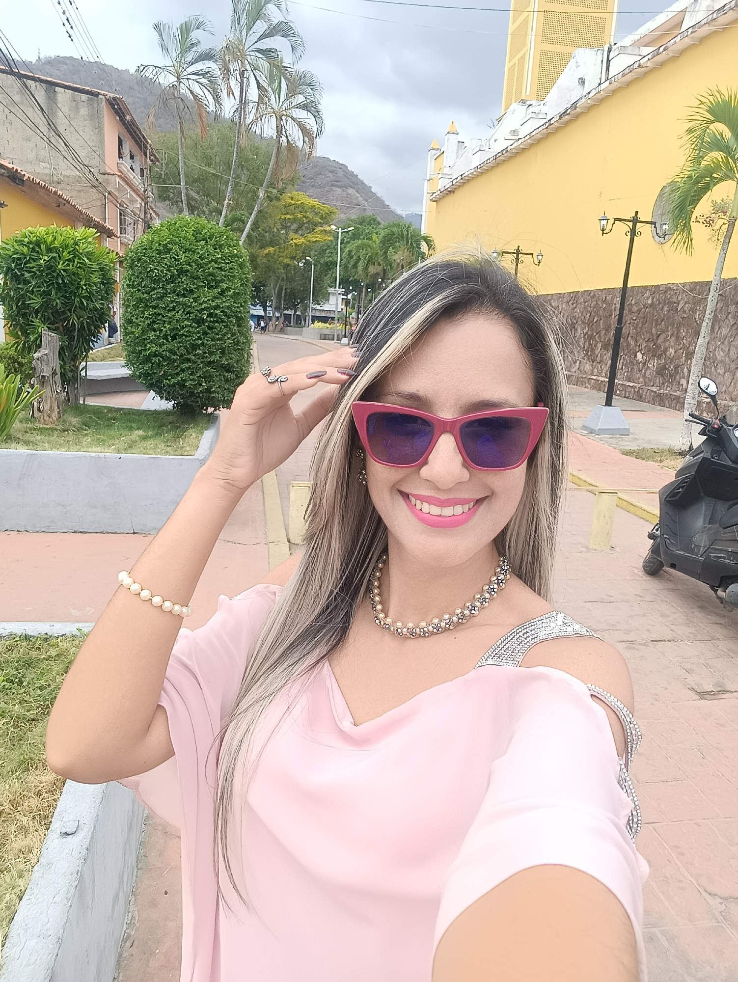 Women photograph themselves during social outing in Las Tejerías