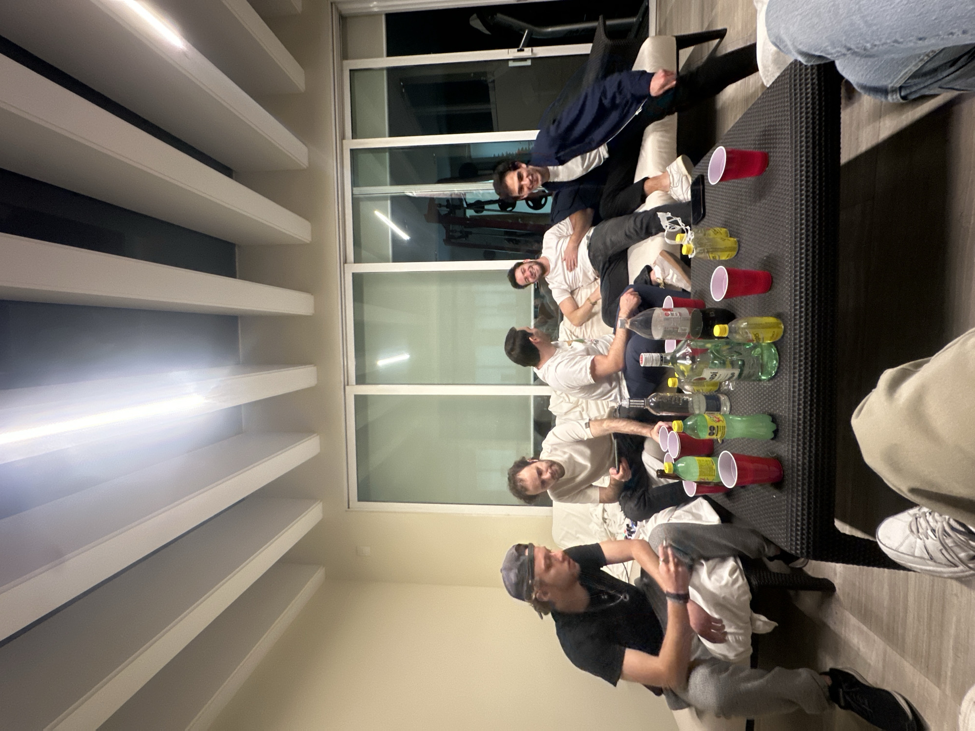 Five young men gather indoors in Santiago Yancuitlalpan