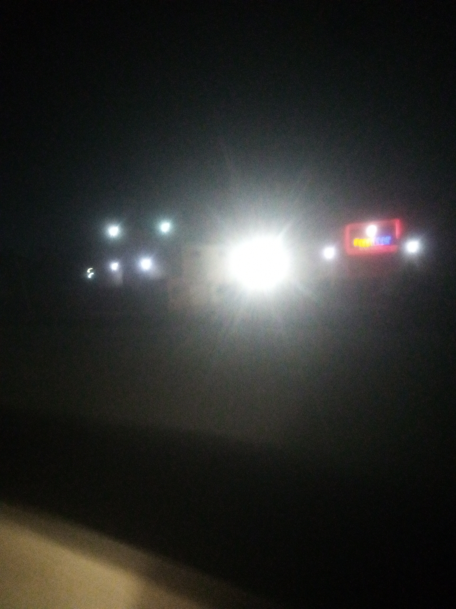 Festive gathering under string lights in rural Nigeria at night