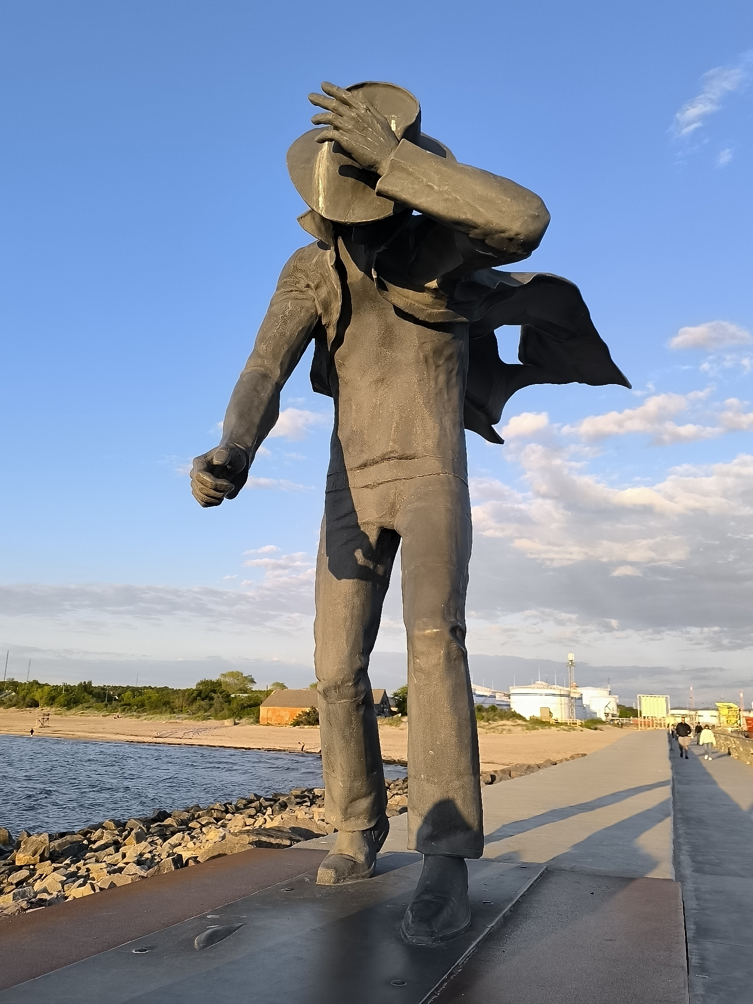 Waterfront scenes documented including statues, ship, and beach