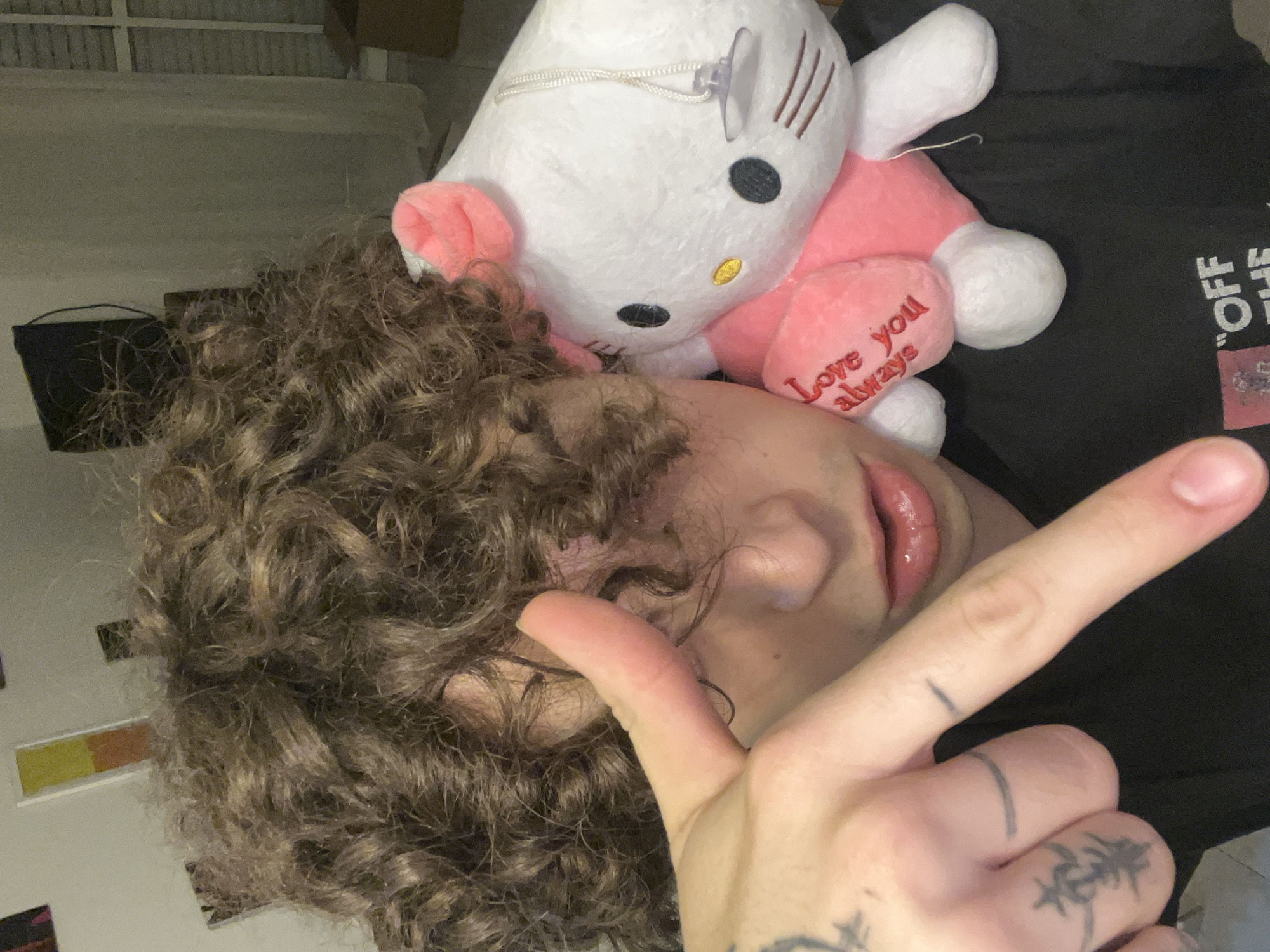 Person poses with Hello Kitty toys in Argentina bedroom