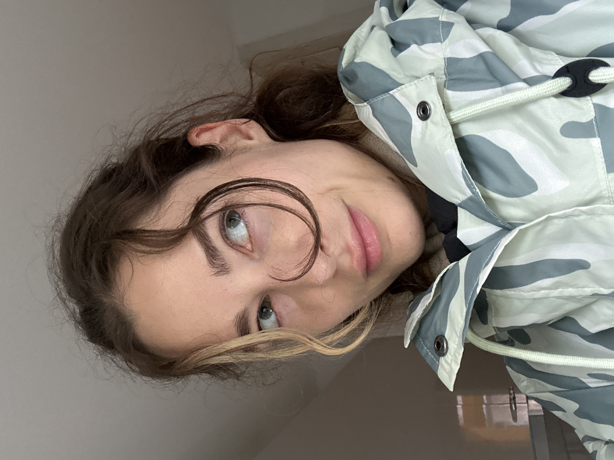 Woman in camo jacket photographed with pie in Kiel