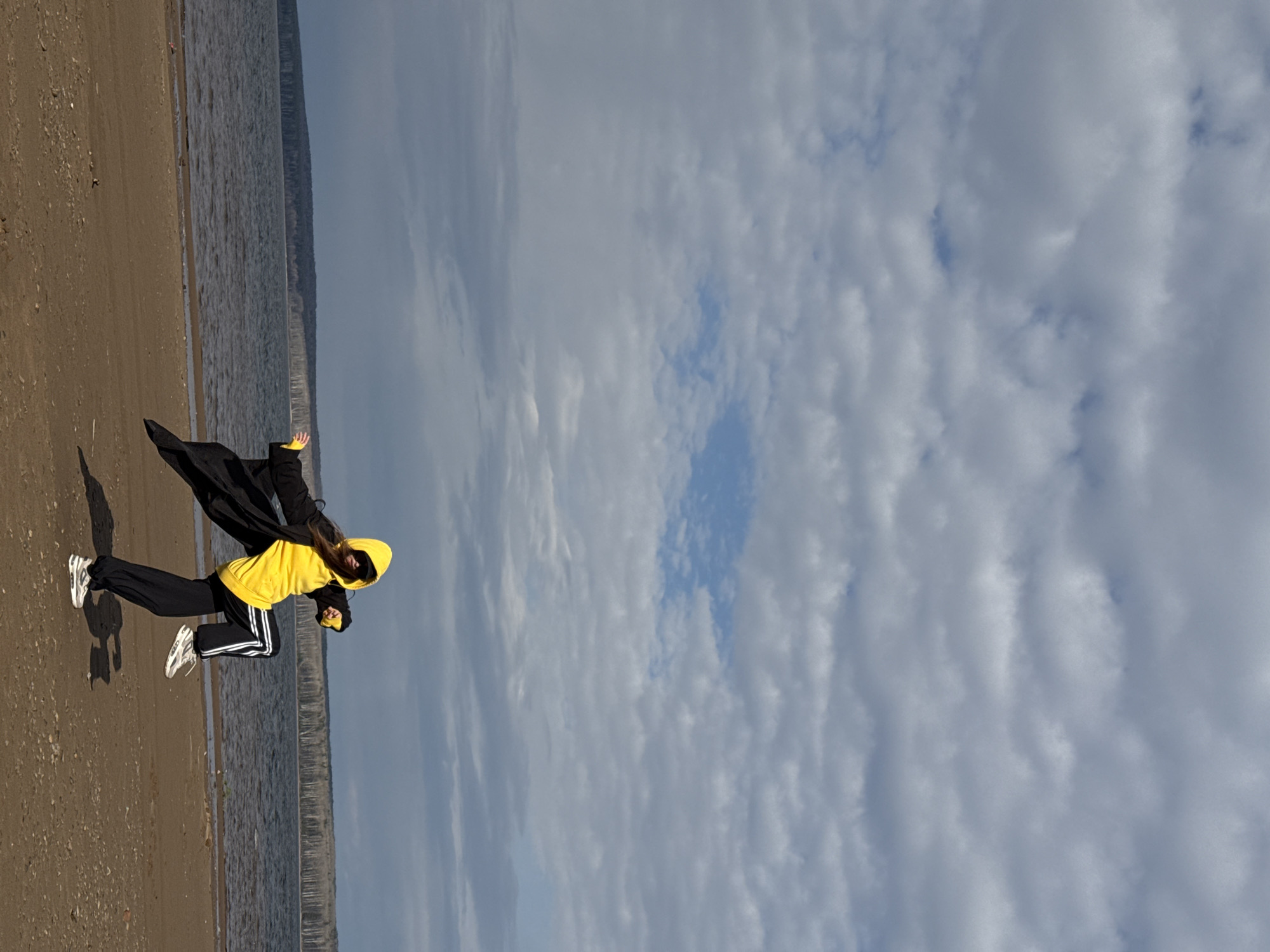 Person walks and poses on beach in Chaikovsky, Russia