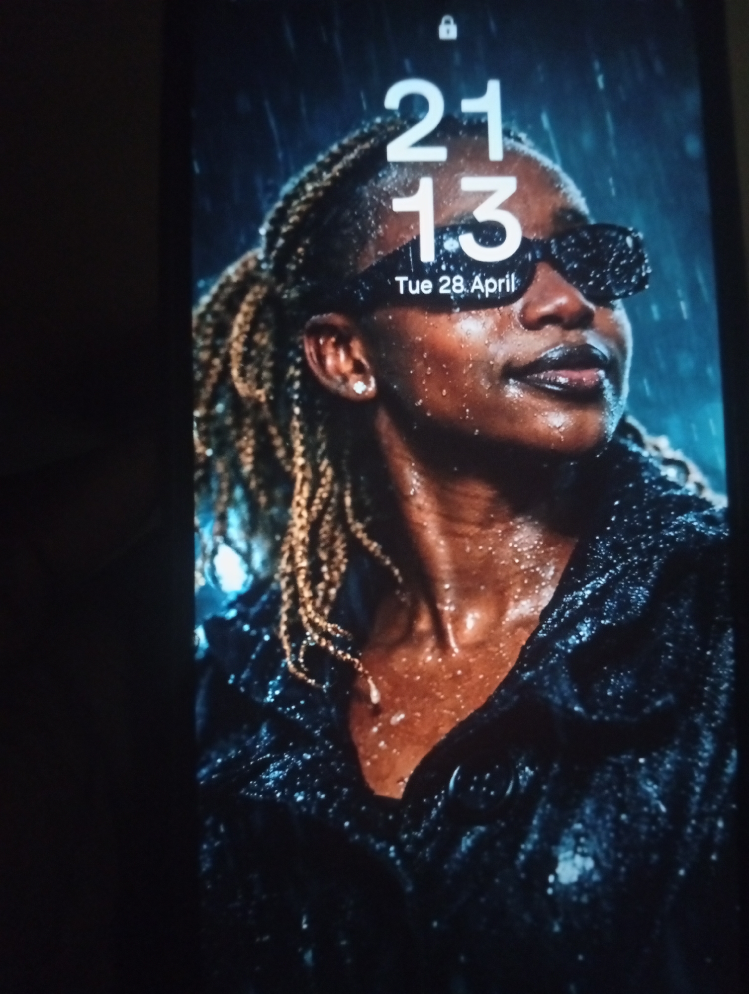 Smartphone displays rainy portrait wallpaper on lock screen