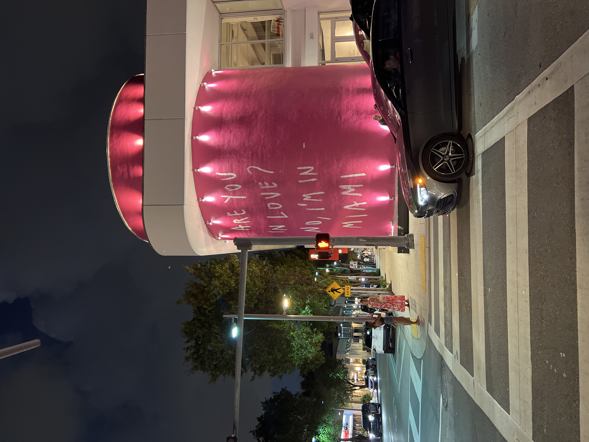 Pink cylindrical building displays love message in Miami streets