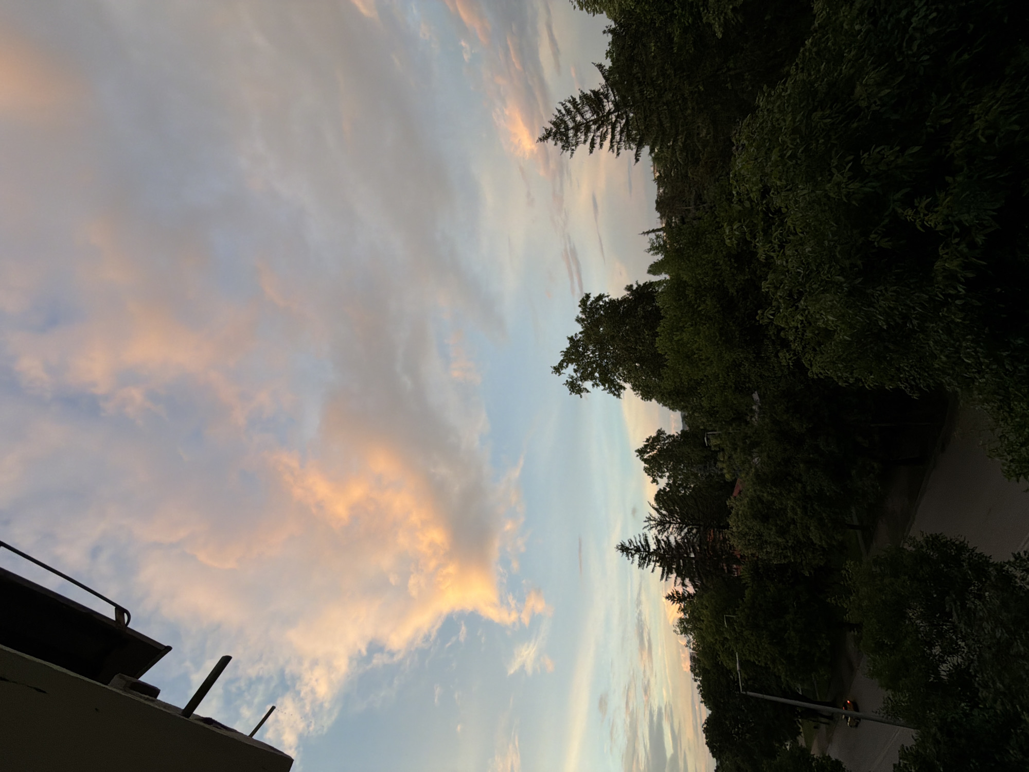 Twilight sky with rainbows observed from elevated position