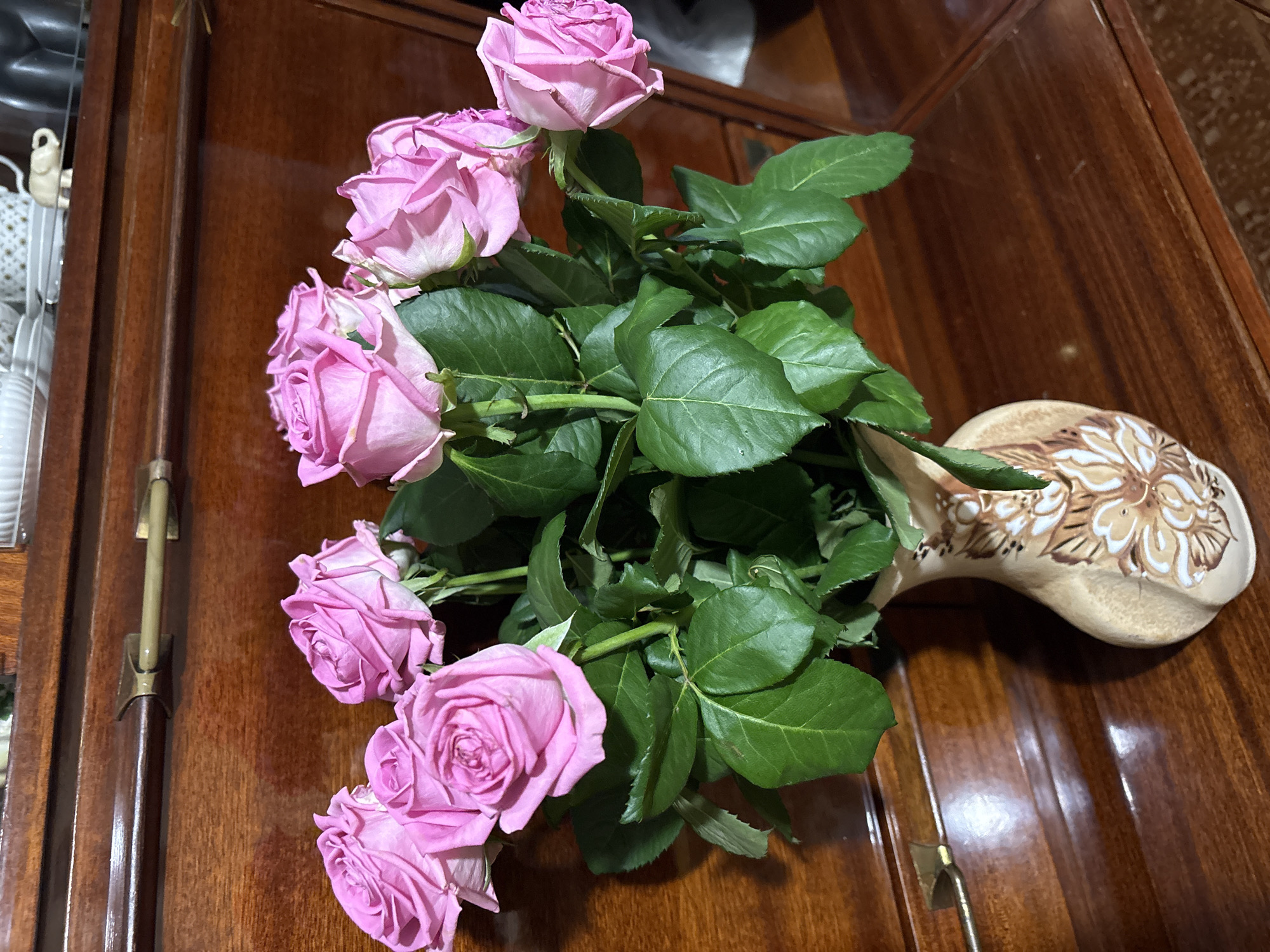 Flower arrangements and a nighttime street scene in Ternopil
