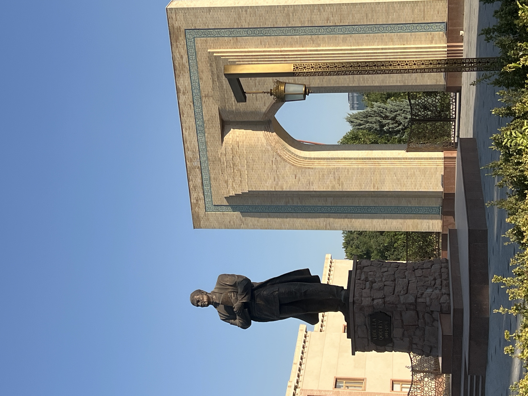 Street scenes and statues along a Tashkent city block