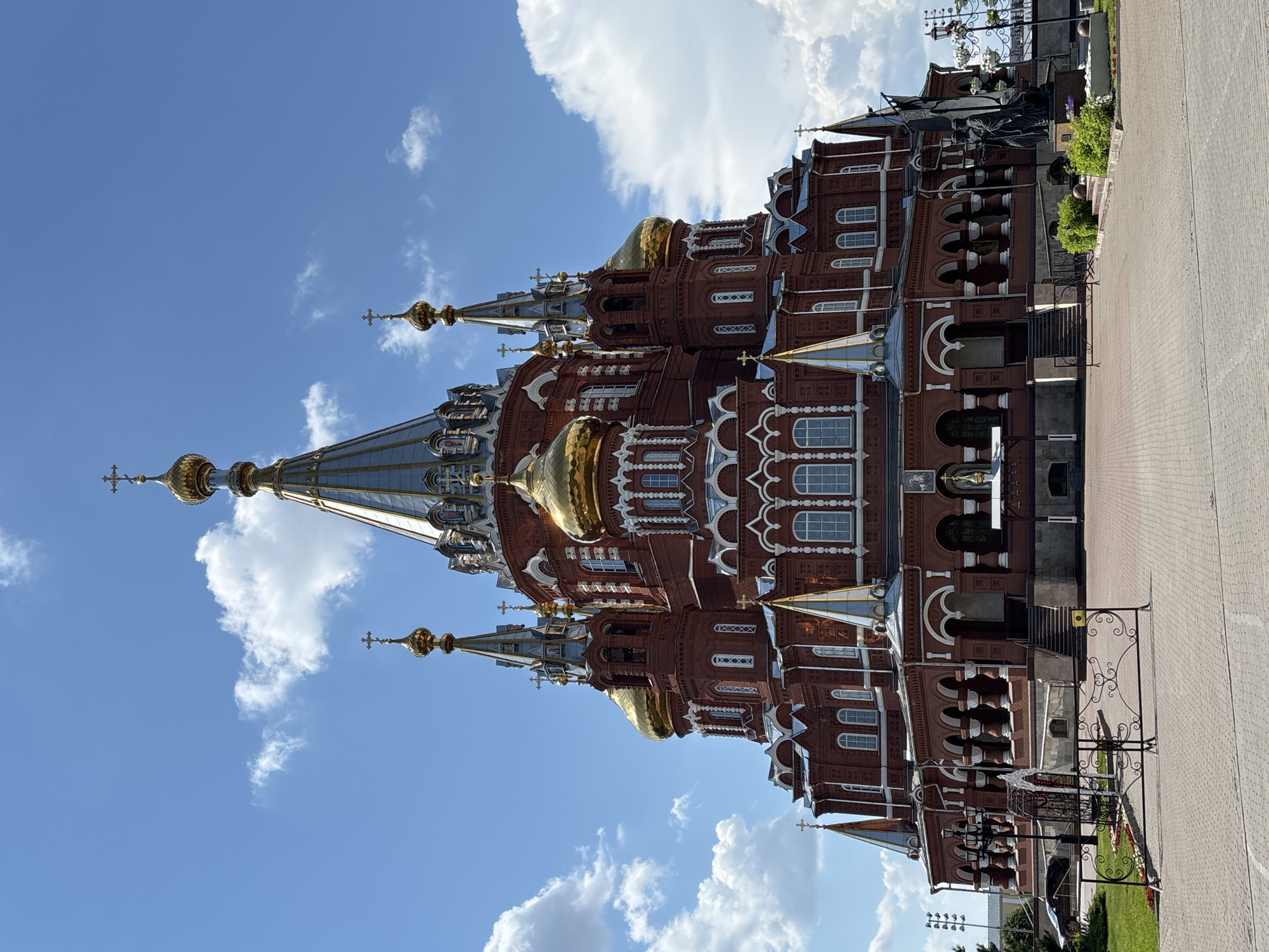Boy enjoys VR simulator and rides near Izhevsk cathedral