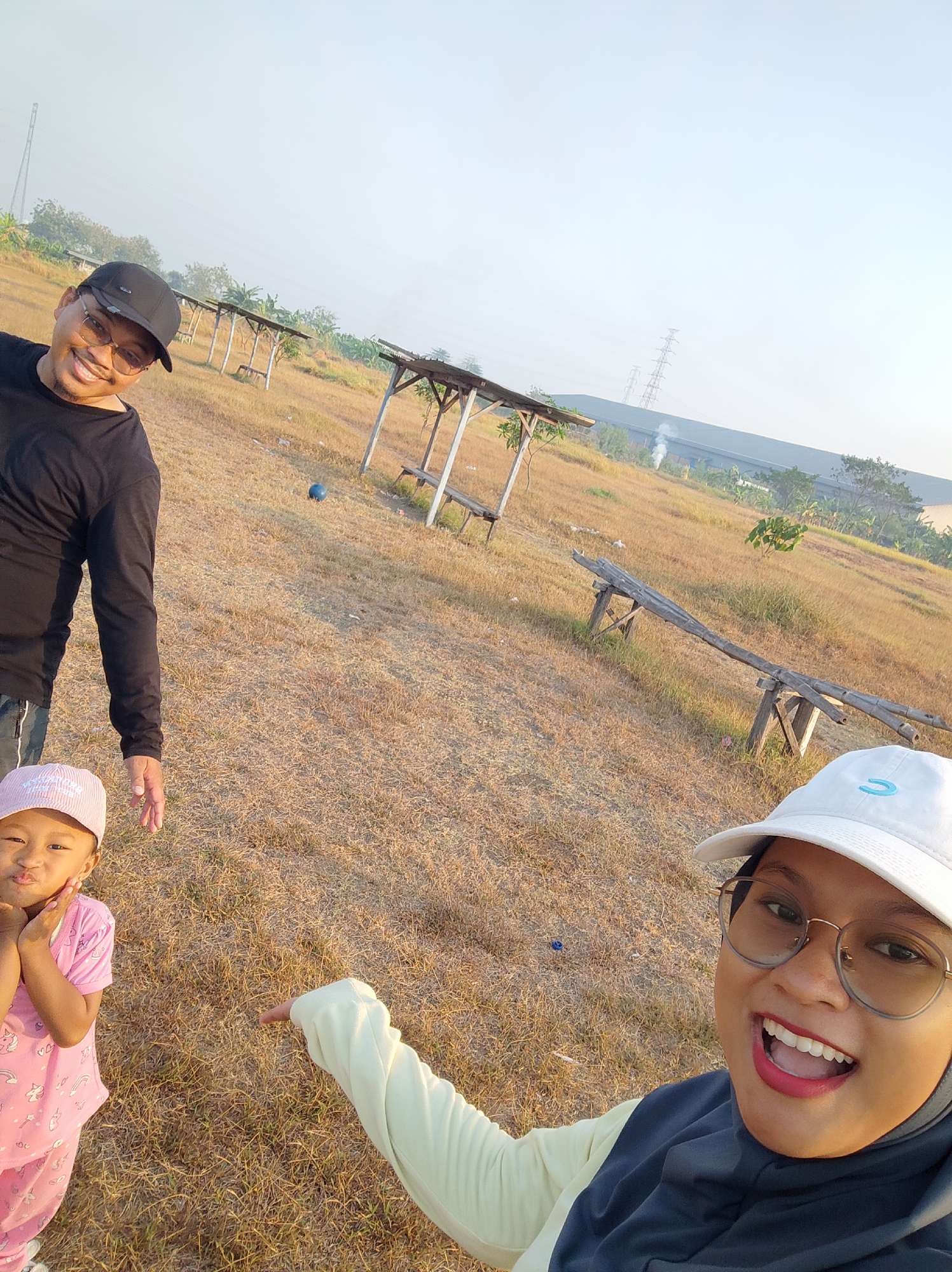 Sunrise over dry fields and dusty paths in East Java