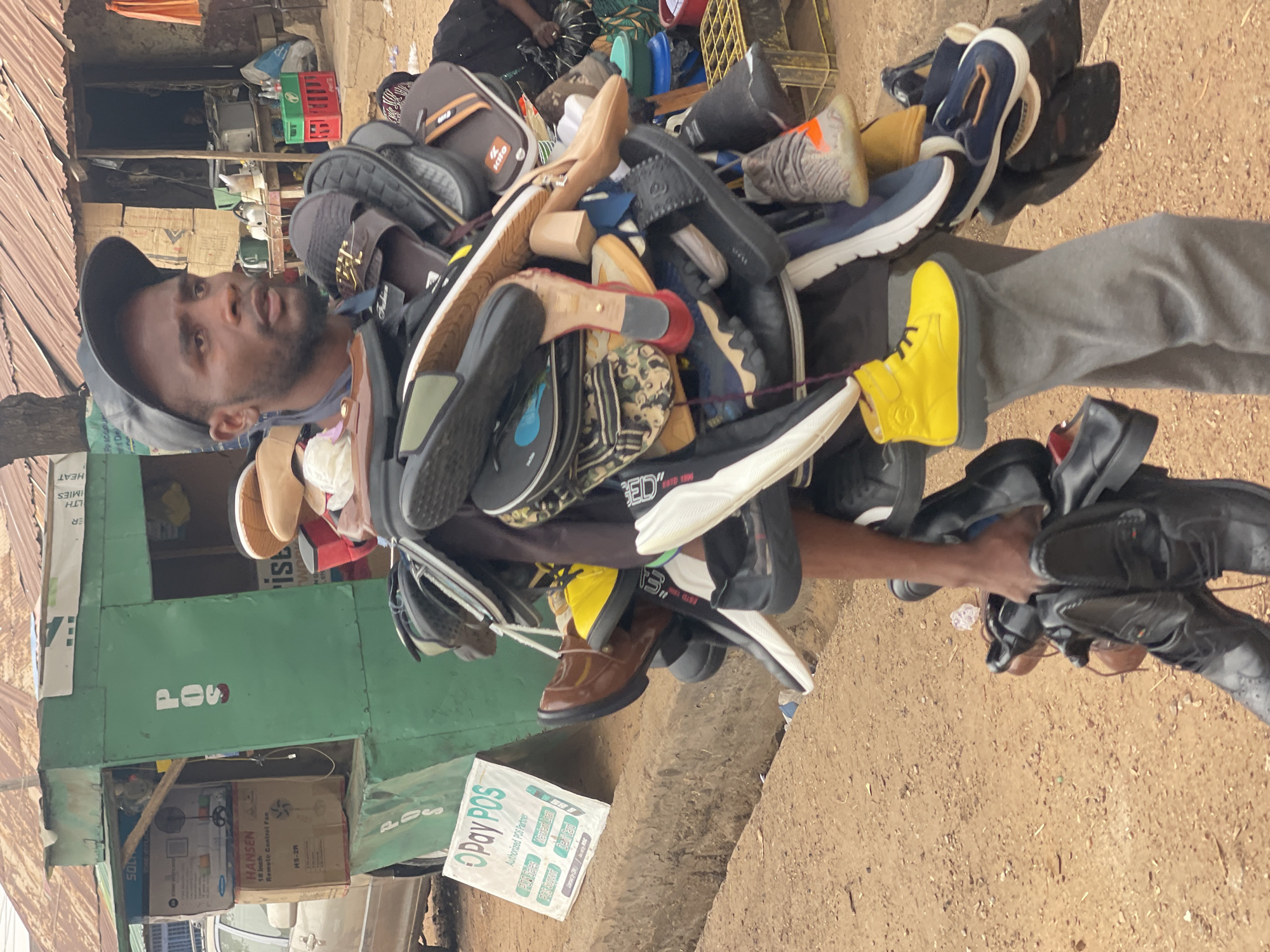 Shoe vendor photographed at Zaria street market