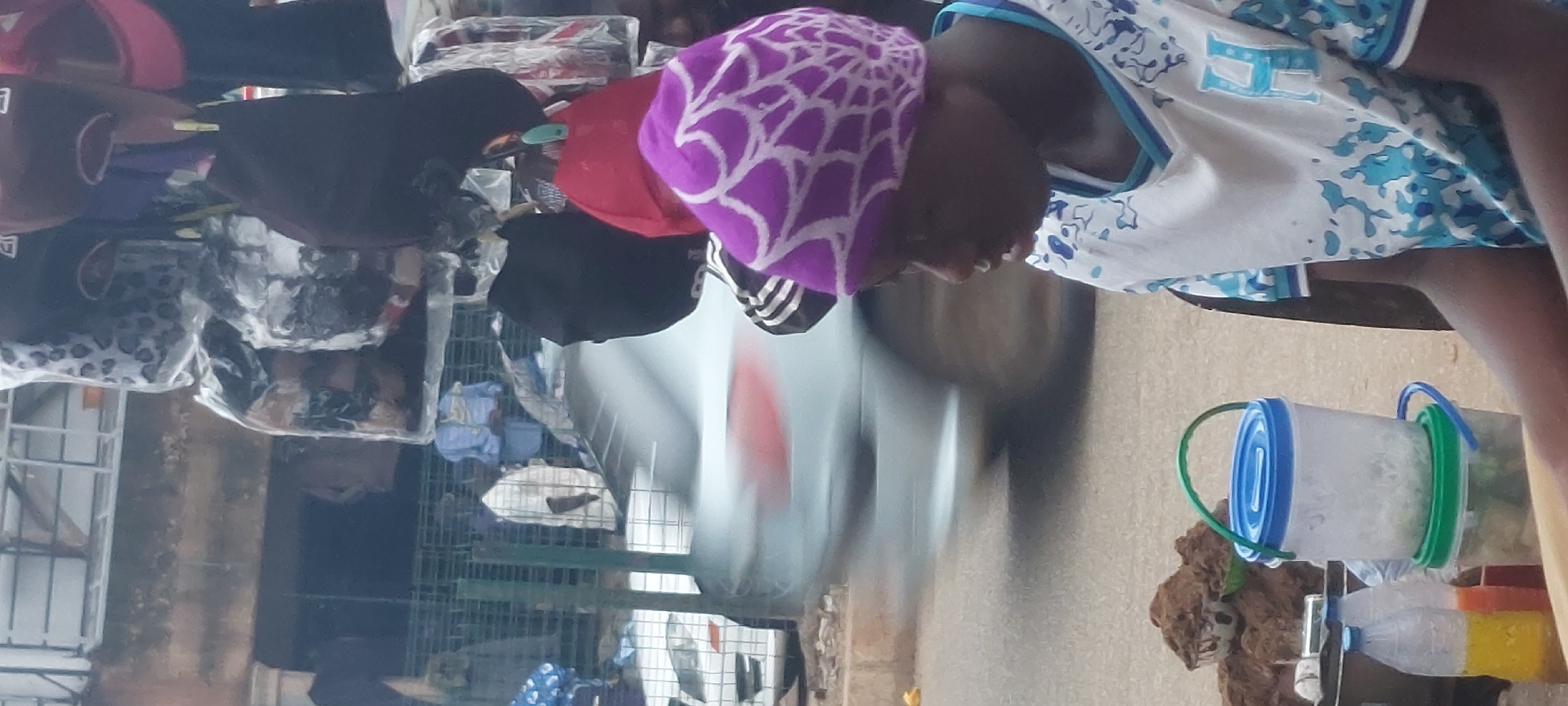 Street market activity with vendors and shoppers browsing goods