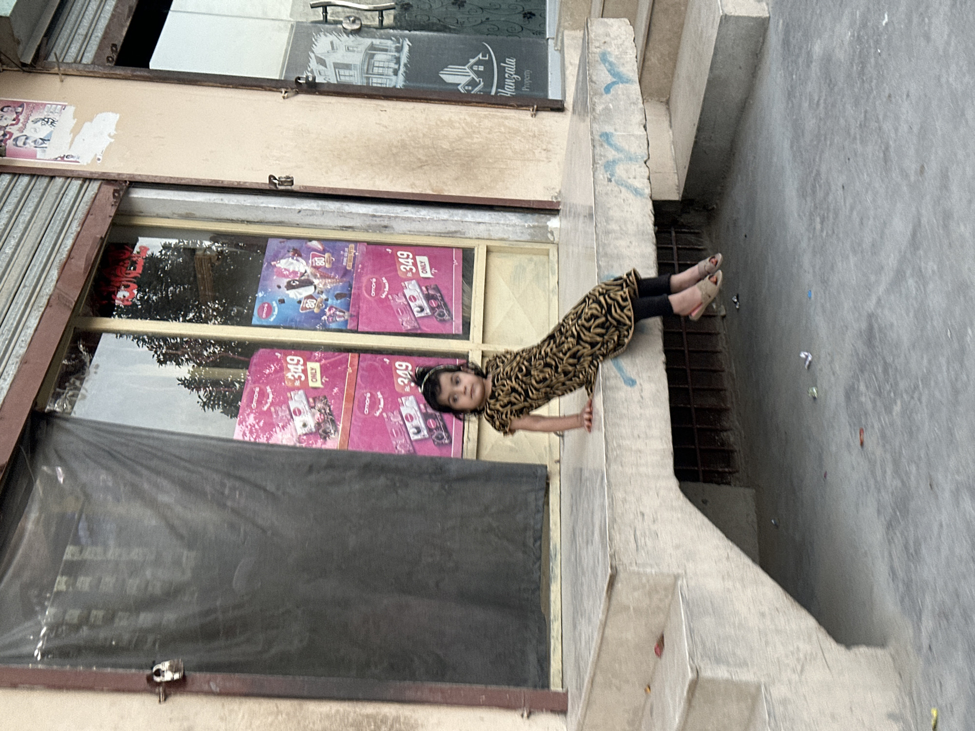 Quiet street moments outside shops in Quetta