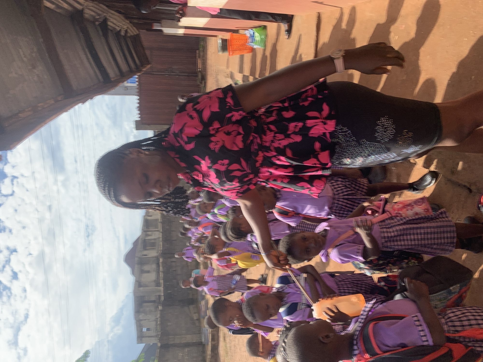 School children gather in courtyard during daytime in Nigeria