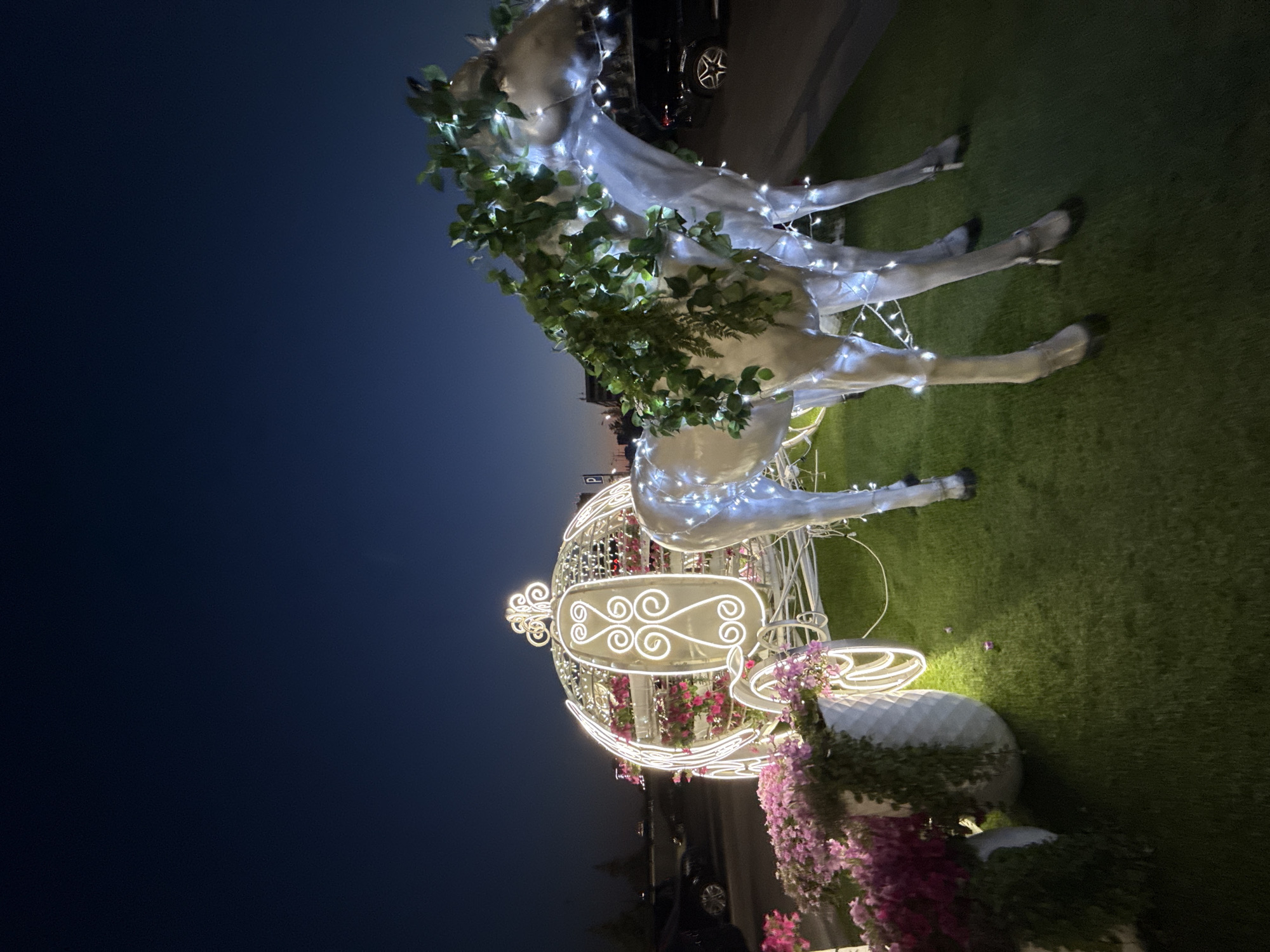 Evening at Kazan's Riviera Hotel: lights, rides, and ornate decor