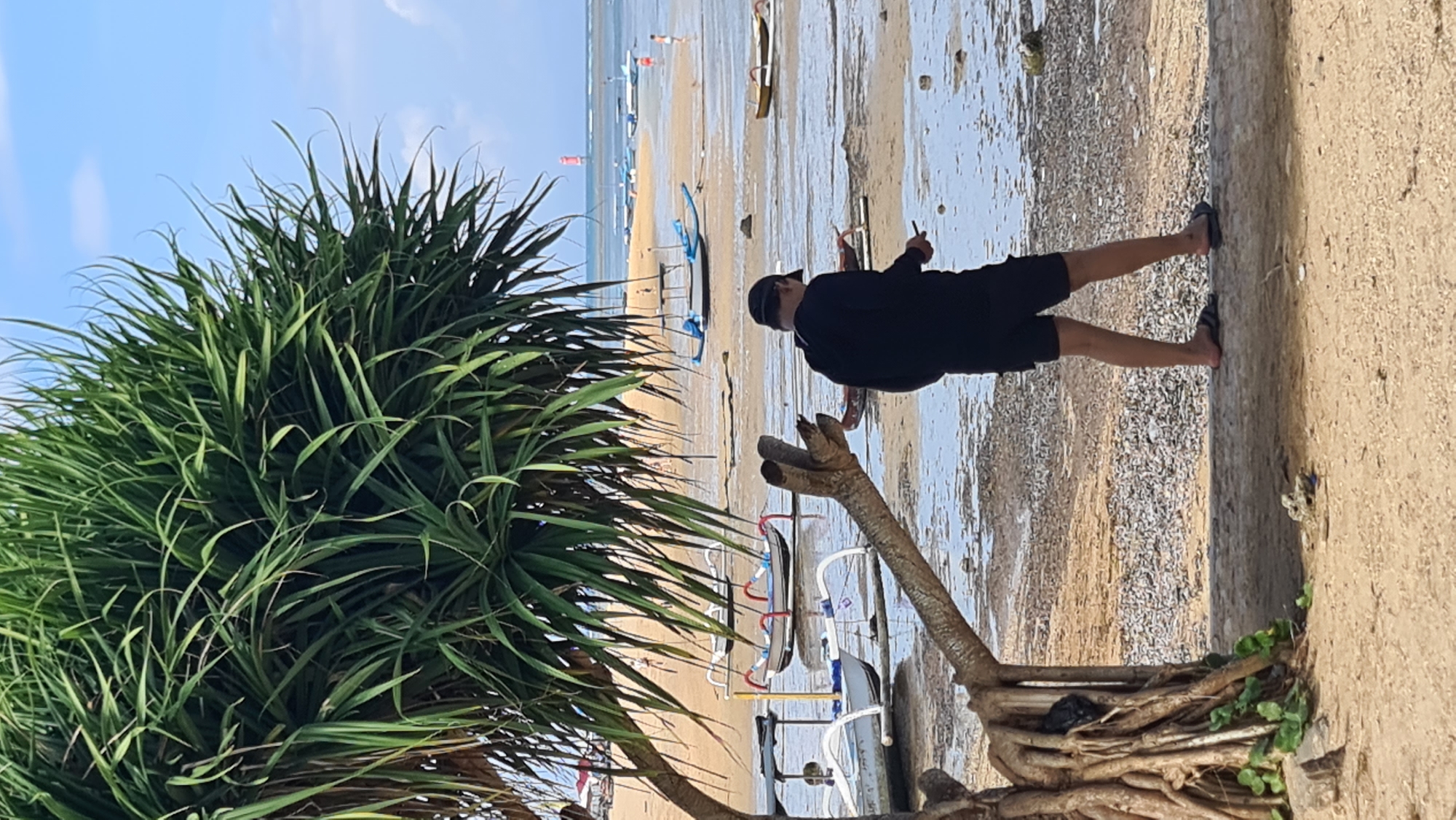 Sanur Beach morning: kitesurfers, strollers, and shoreline calm