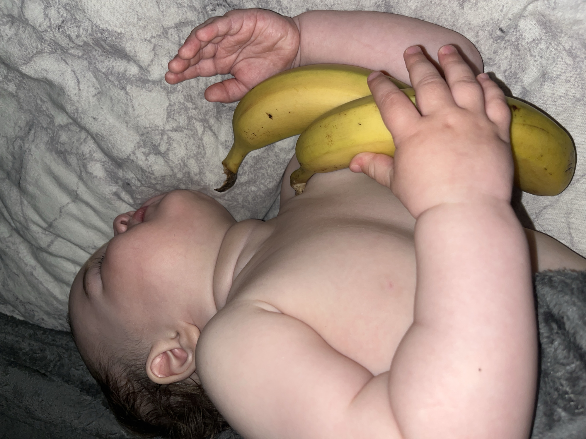 Baby photographed sleeping with bananas in Shushary, Russia