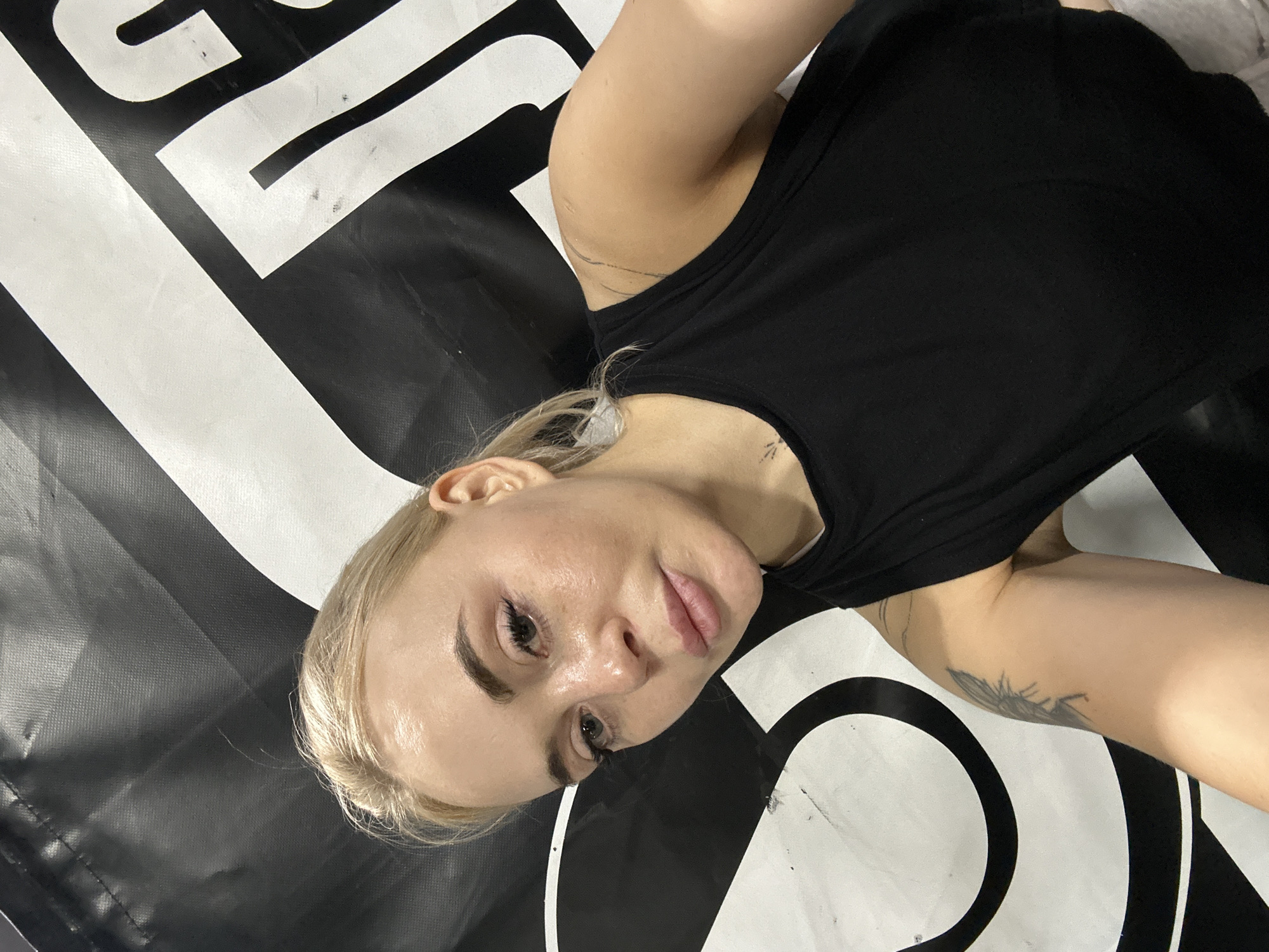 Woman photographed during fitness session in Megion boxing gym