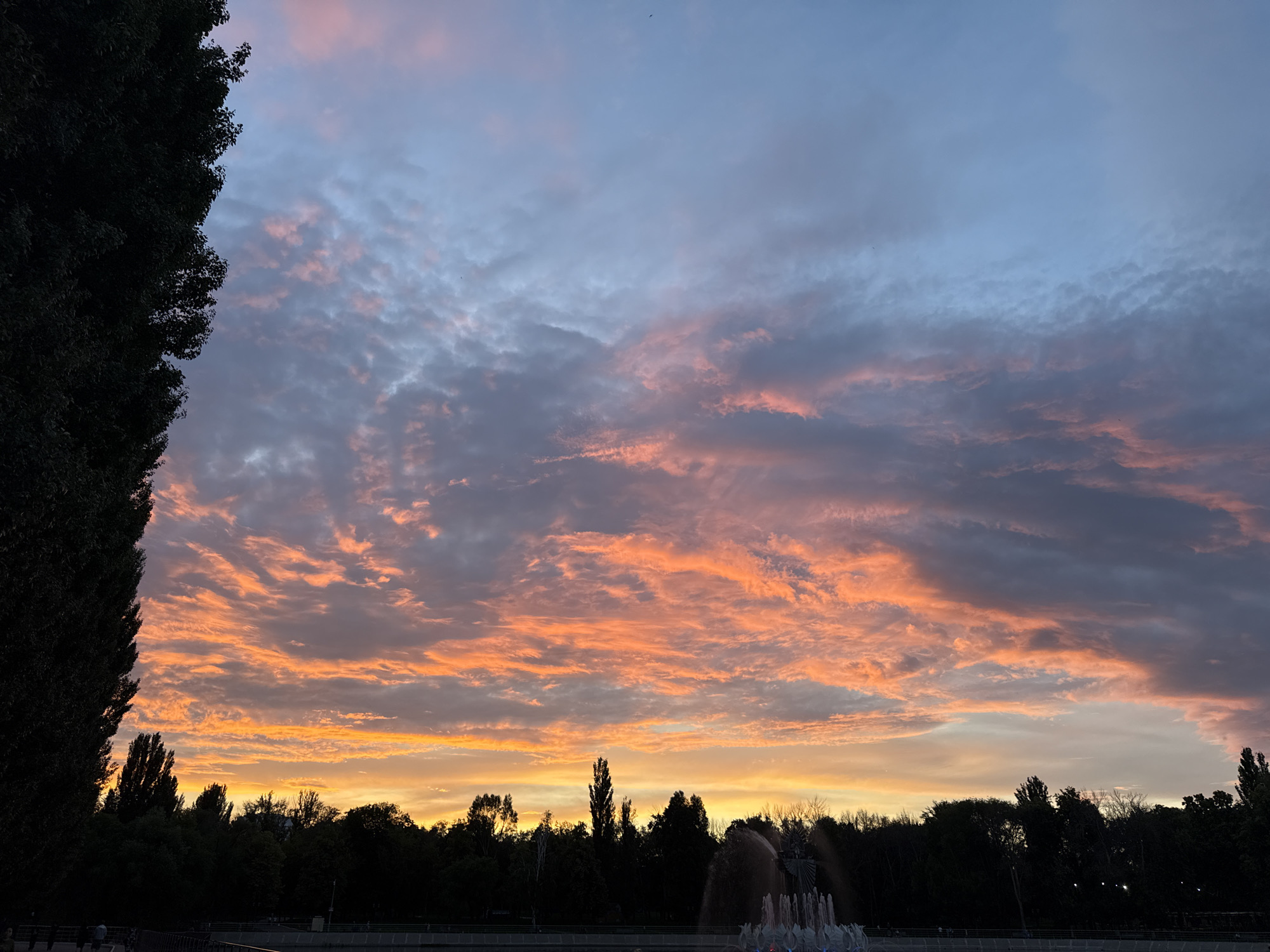 Sunset fountain scene with ducks at Volga embankment