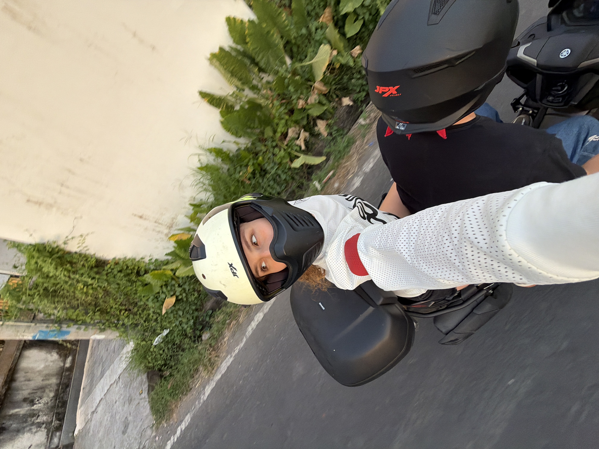 Motorcycle riders, cyclists captured in North Kuta sunset scenes