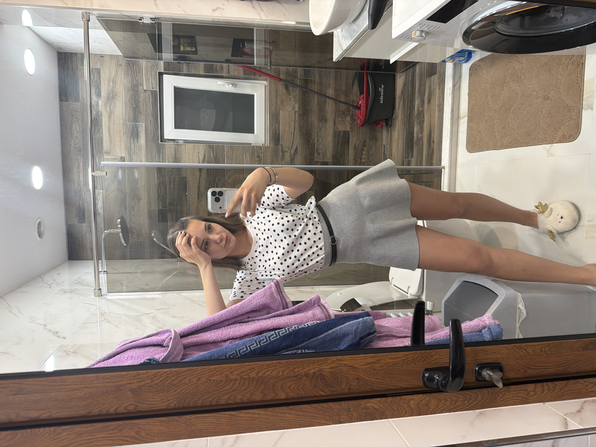 Woman takes bathroom selfies in Buhovo, Bulgaria