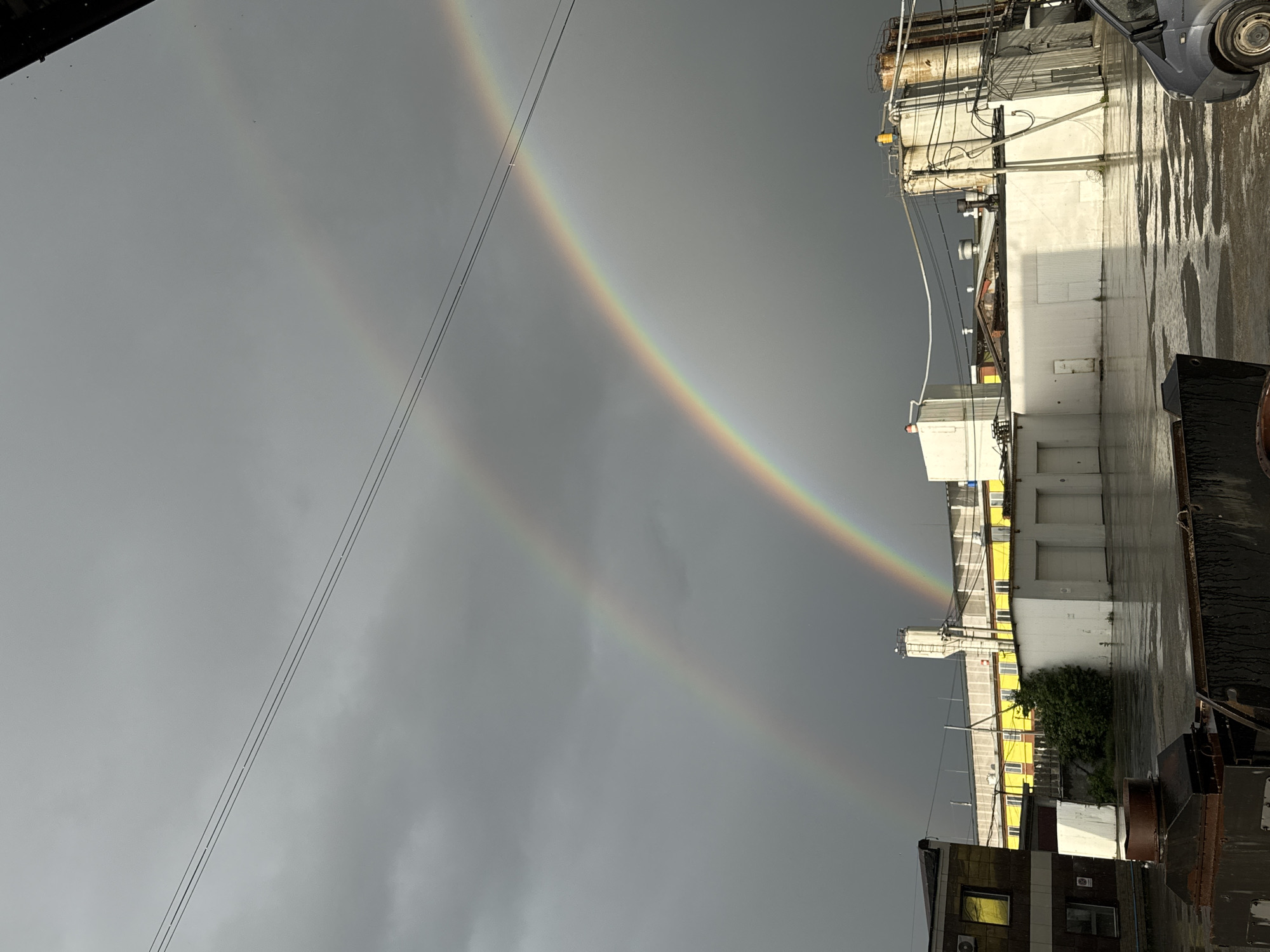 Double rainbow appears over Perm industrial district after rainfall