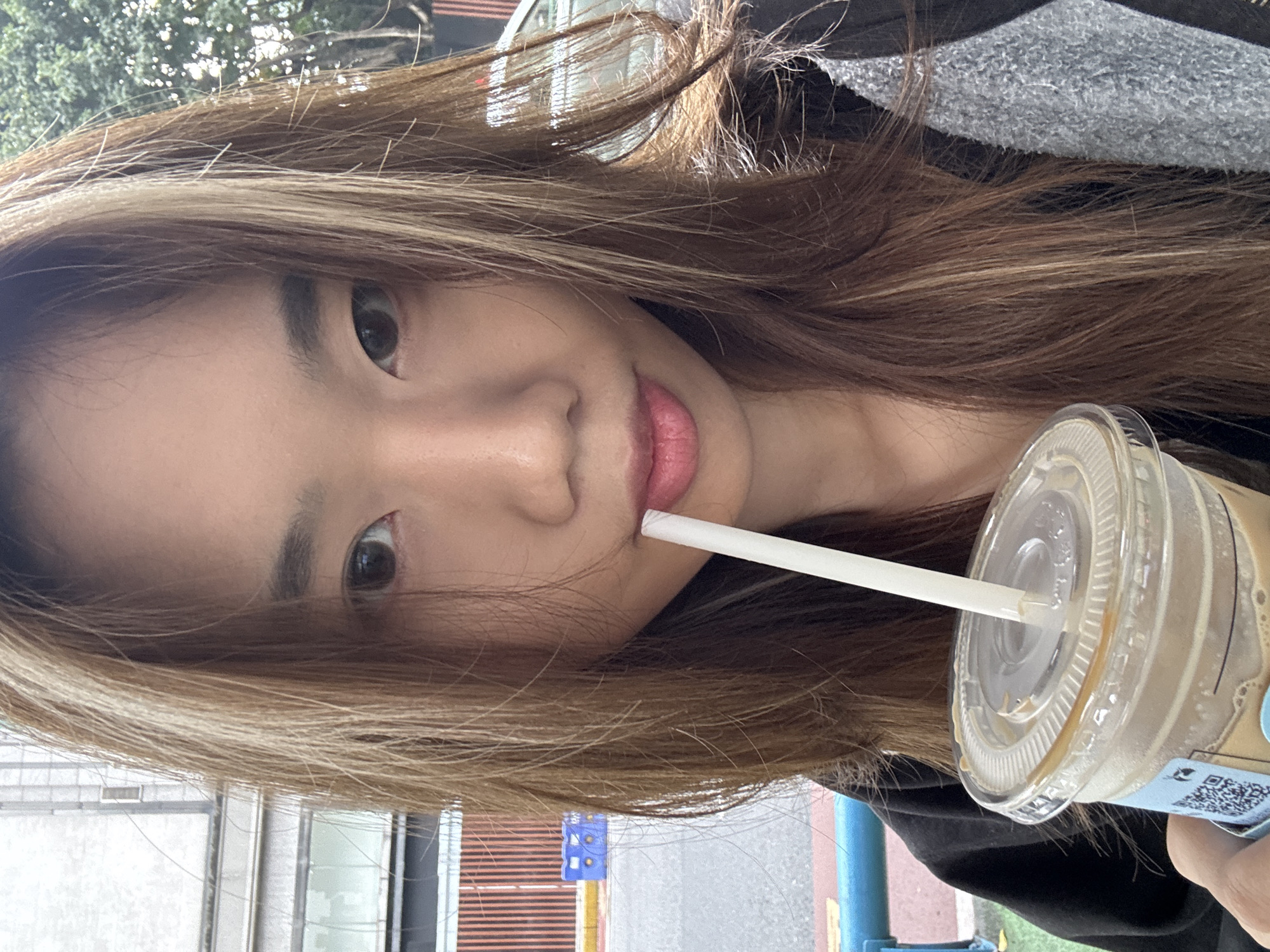 Woman takes morning selfies with coffee in Shapingba District