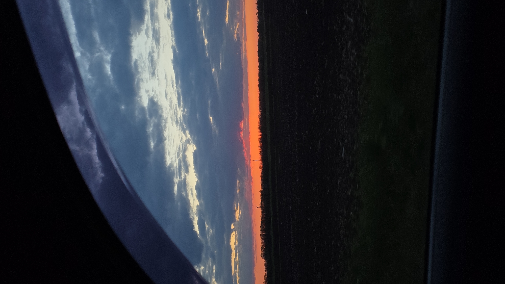 Dramatic sunset observed over rural Kavarna landscape from vehicle