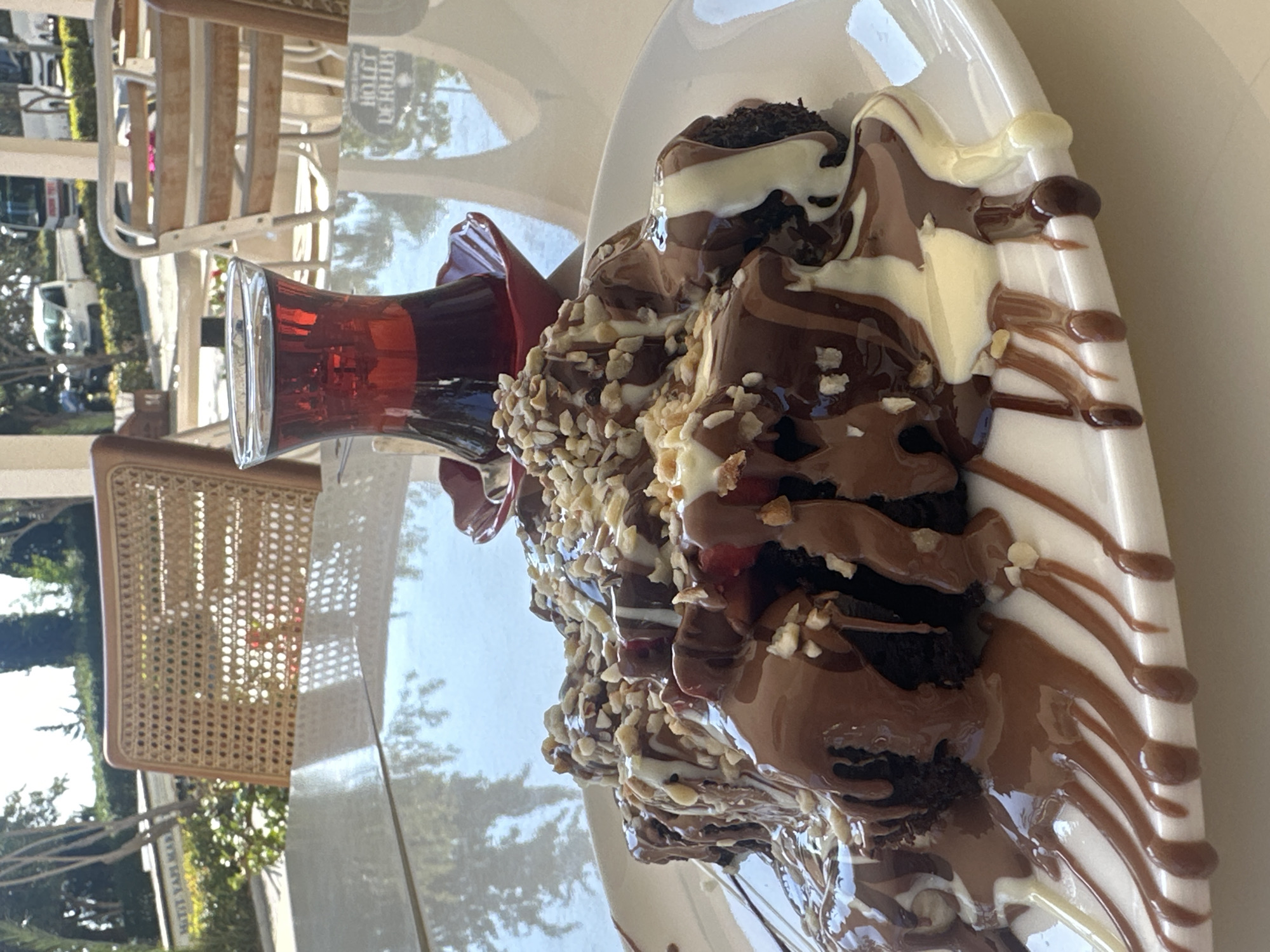 Tourist captures dessert and harbor views in Kaş, Turkey