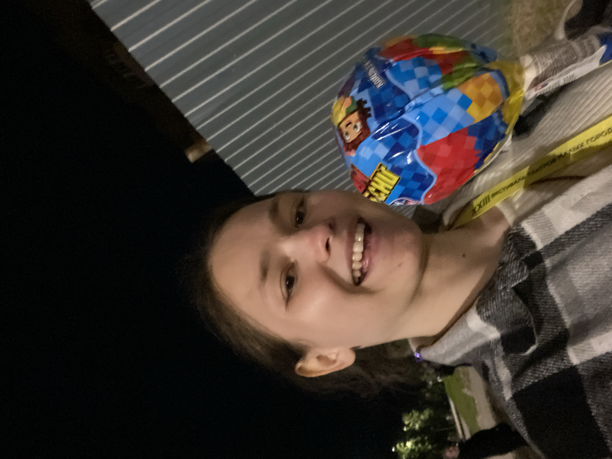 Woman poses with cartoon balloon in Peresvet, Russia