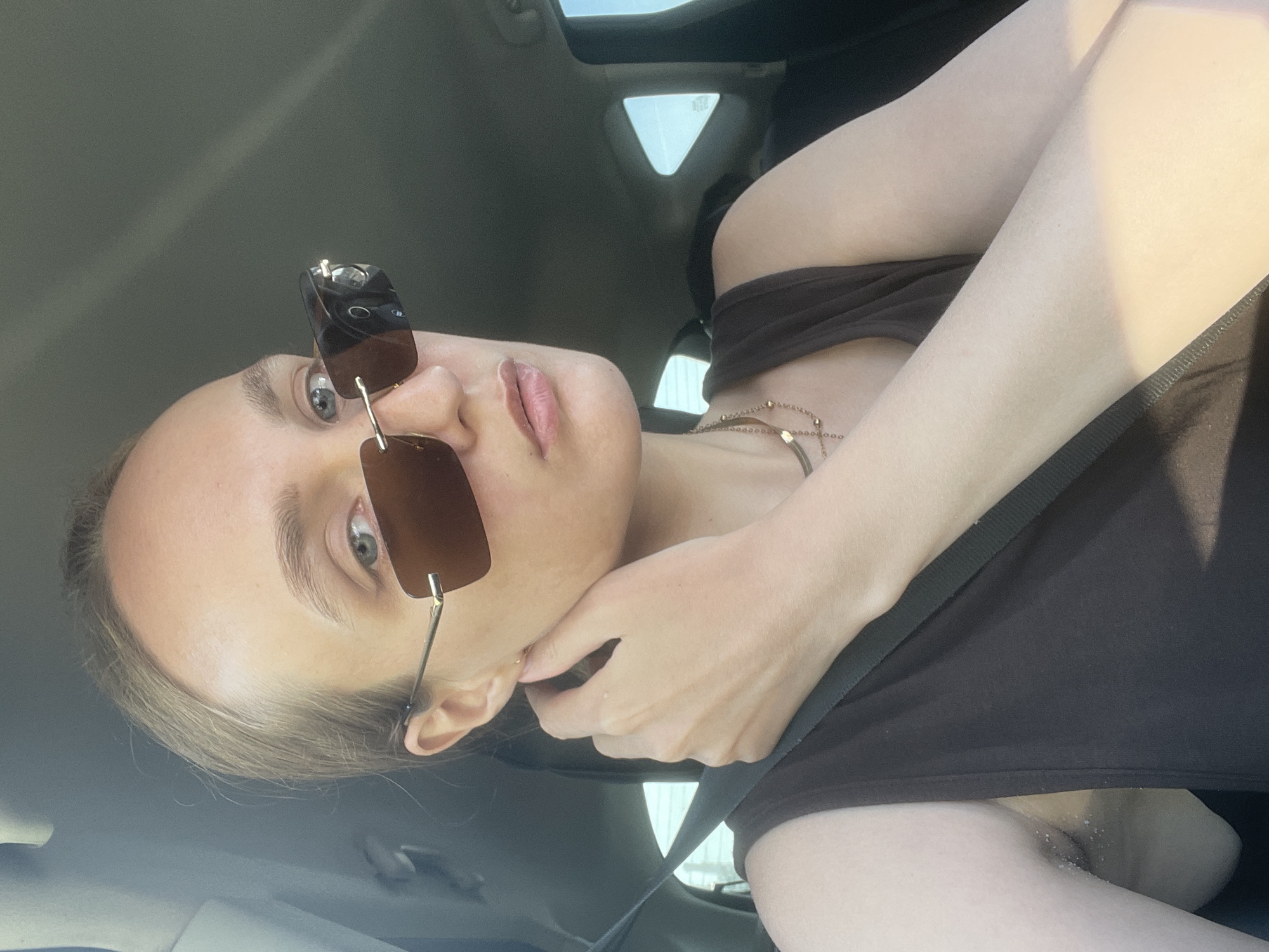 Woman in car, cityscape views captured in Izhevsk