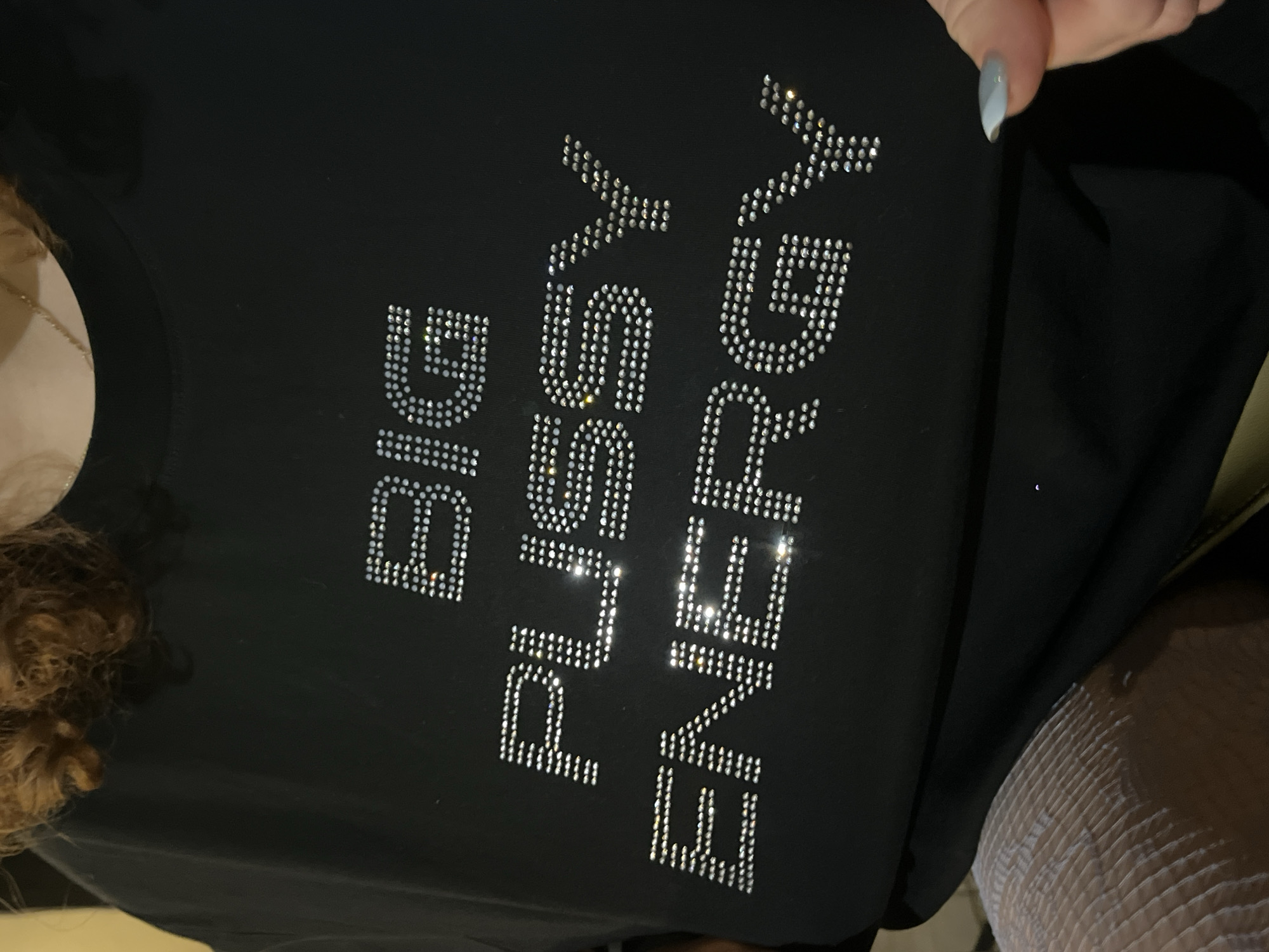 Rhinestone slogan garment spotted in Tel Aviv